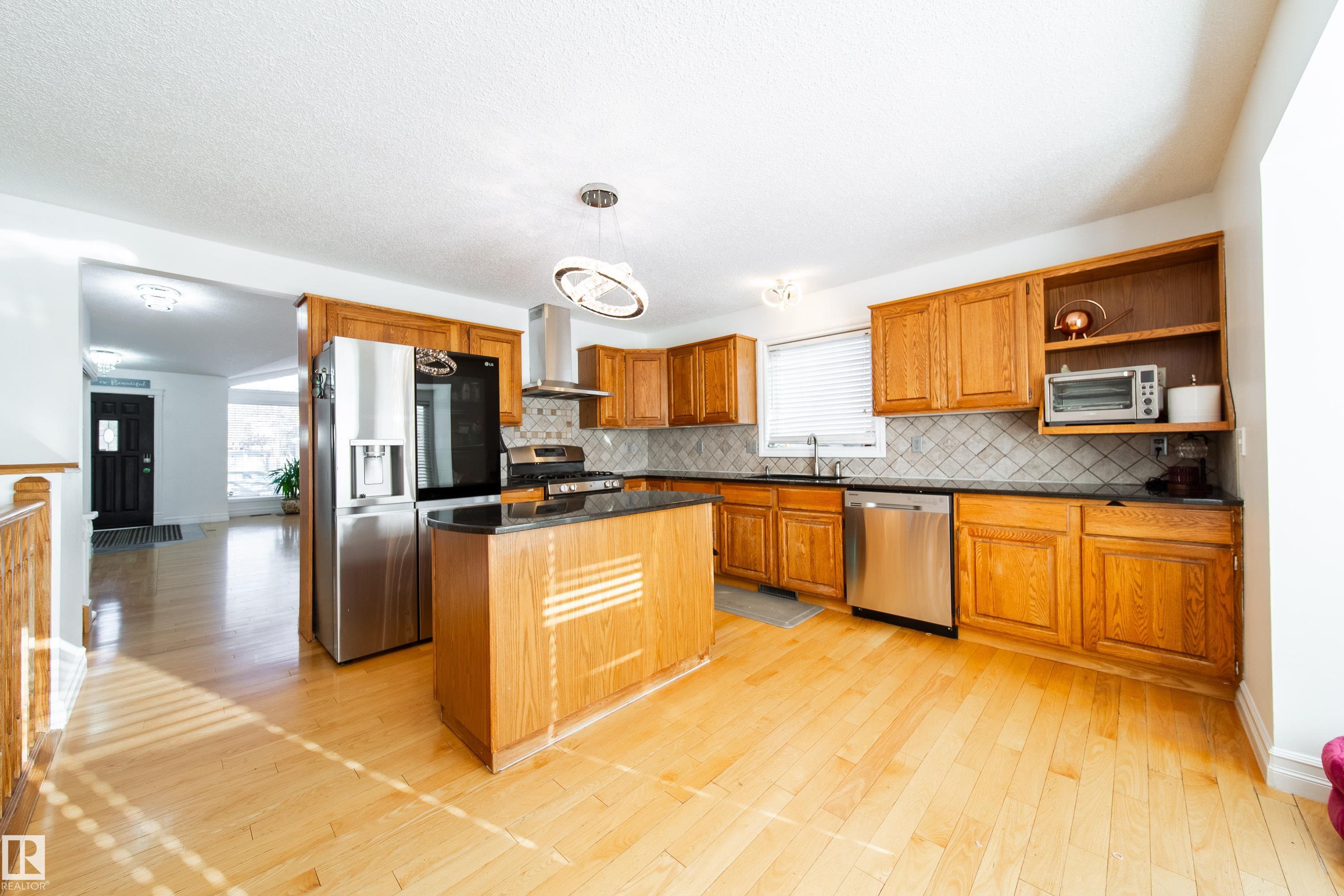 Photo 11 at 18007 57 Avenue NW, Dechene, Edmonton