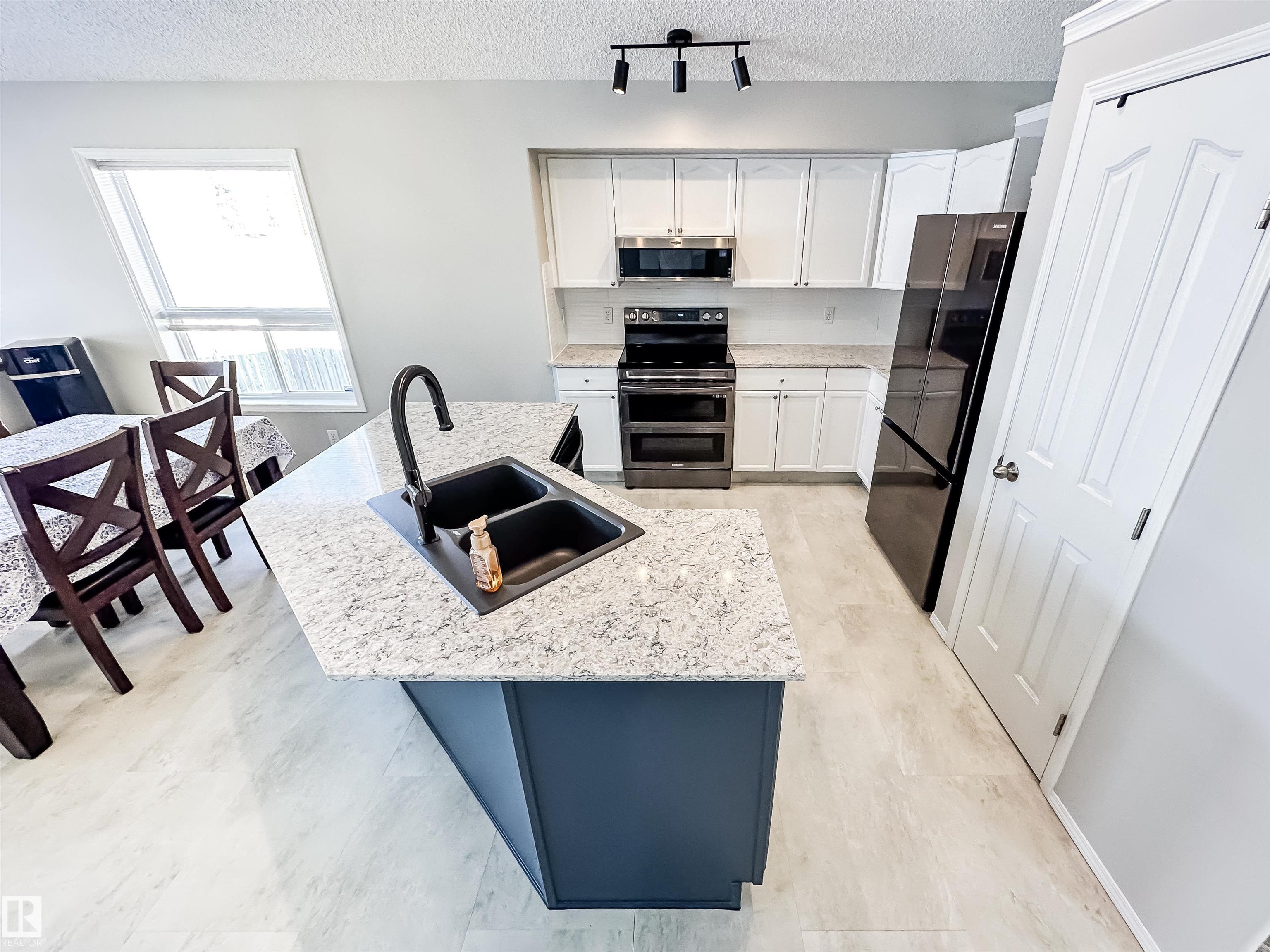Photo 11 at 13036 139 Street NW, Athlone, Edmonton