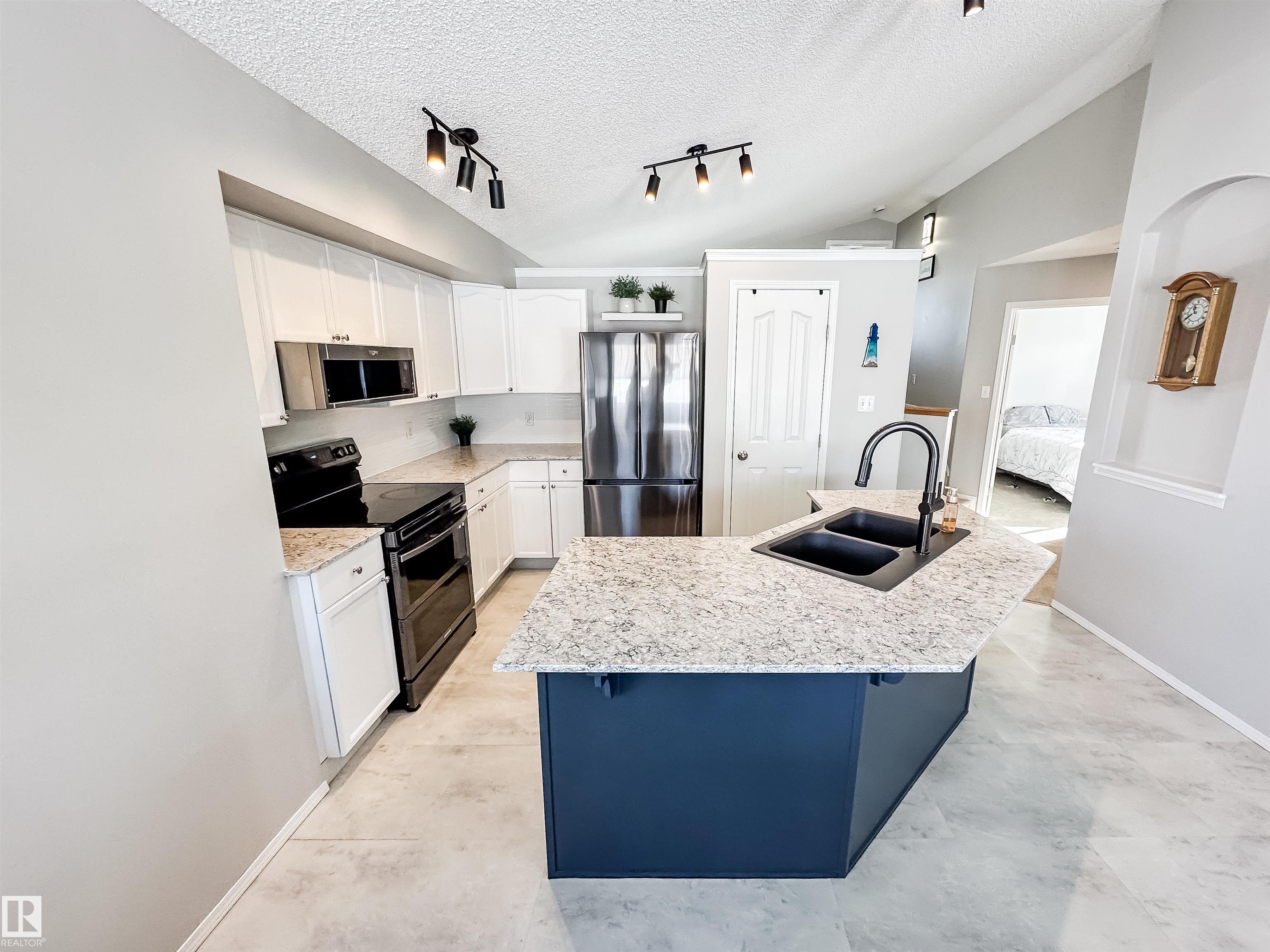 Photo 10 at 13036 139 Street NW, Athlone, Edmonton