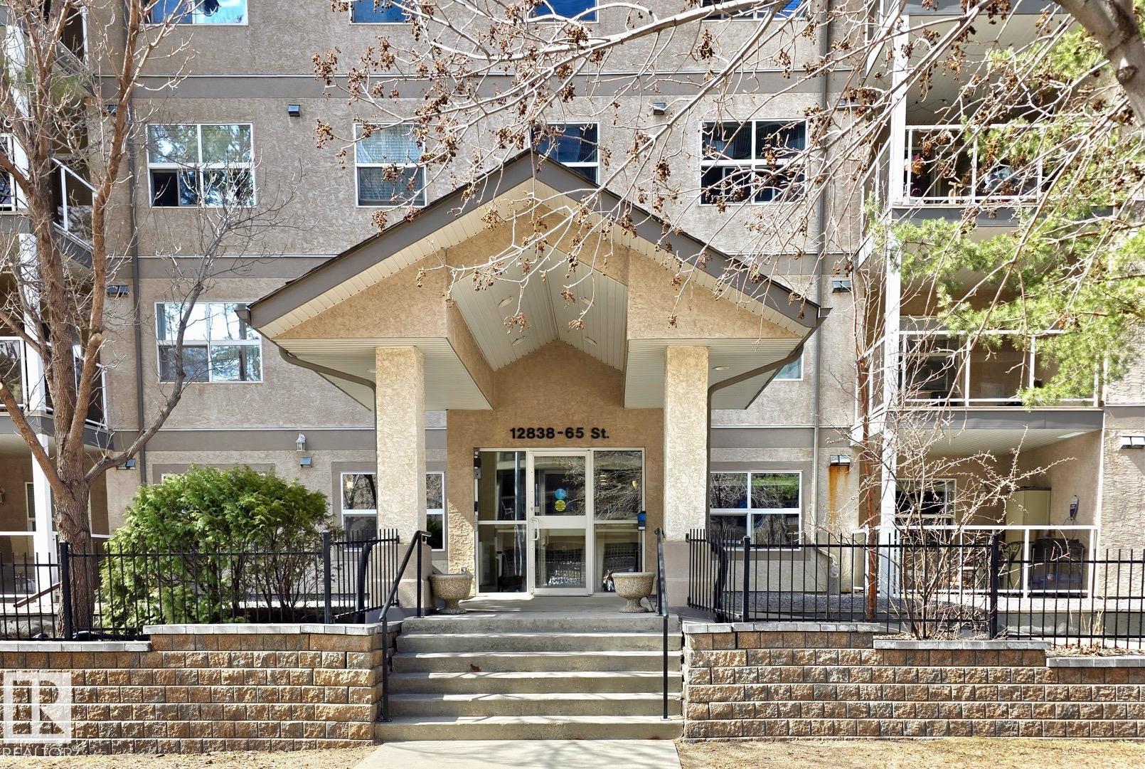 Welcome to The Bona Vista! This east-facing top floor 873 sq.ft. unit,  features 2 bed, 1 bath, elevator, underground parking and insuite laundry. As you enter you are greeted with a spacious floor plan, gorgeous vaulted ceilings, laminate flooring and great natural light. The living room, dining and kitchen areas, blend seamlessly together making for a great space to entertain. The open kitchen features a peninsula island with seating, upgraded appliances and pantry closet. There is easy access out to the covered balcony area, with plenty of room for patio set + bbq, with quiet east-facing views. The bedrooms are both spacious in size with great closet space and large windows. Off the primary suite, you will find access to the main 4-piece bathroom for added convenience. Close to schools, shopping, restaurants and walking distance to LRT and bus stations. Great complex that is well maintained and managed, featuring good visitor parking, affordable condo fees and impressive fitness area. Come have a look!