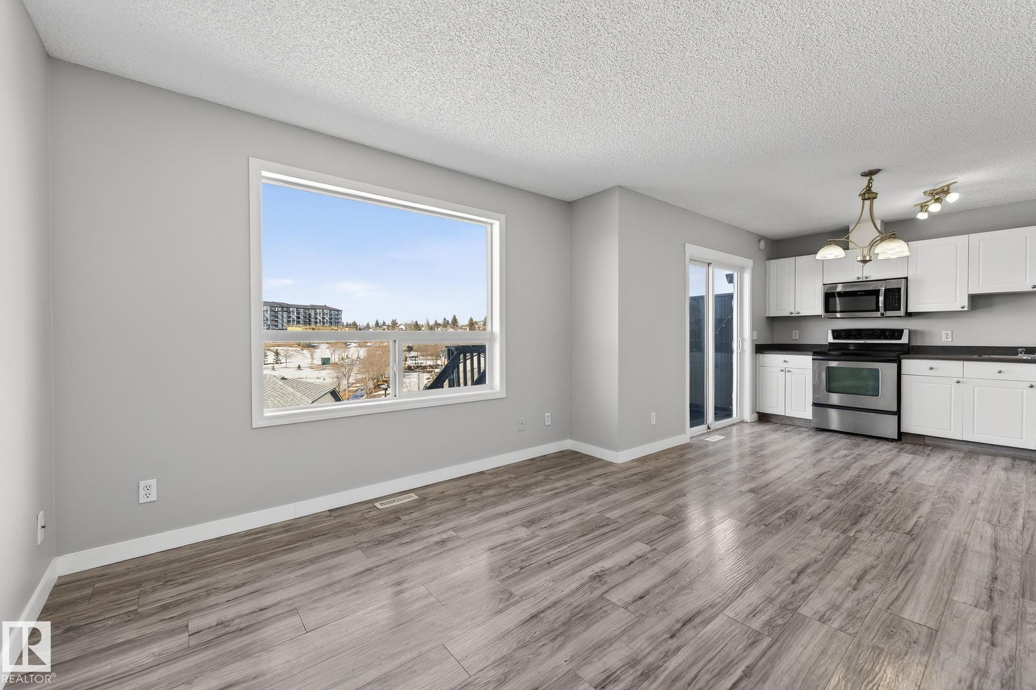 Photo 11 at 30 - 450 Hyndman Crescent NW, Canon Ridge, Edmonton