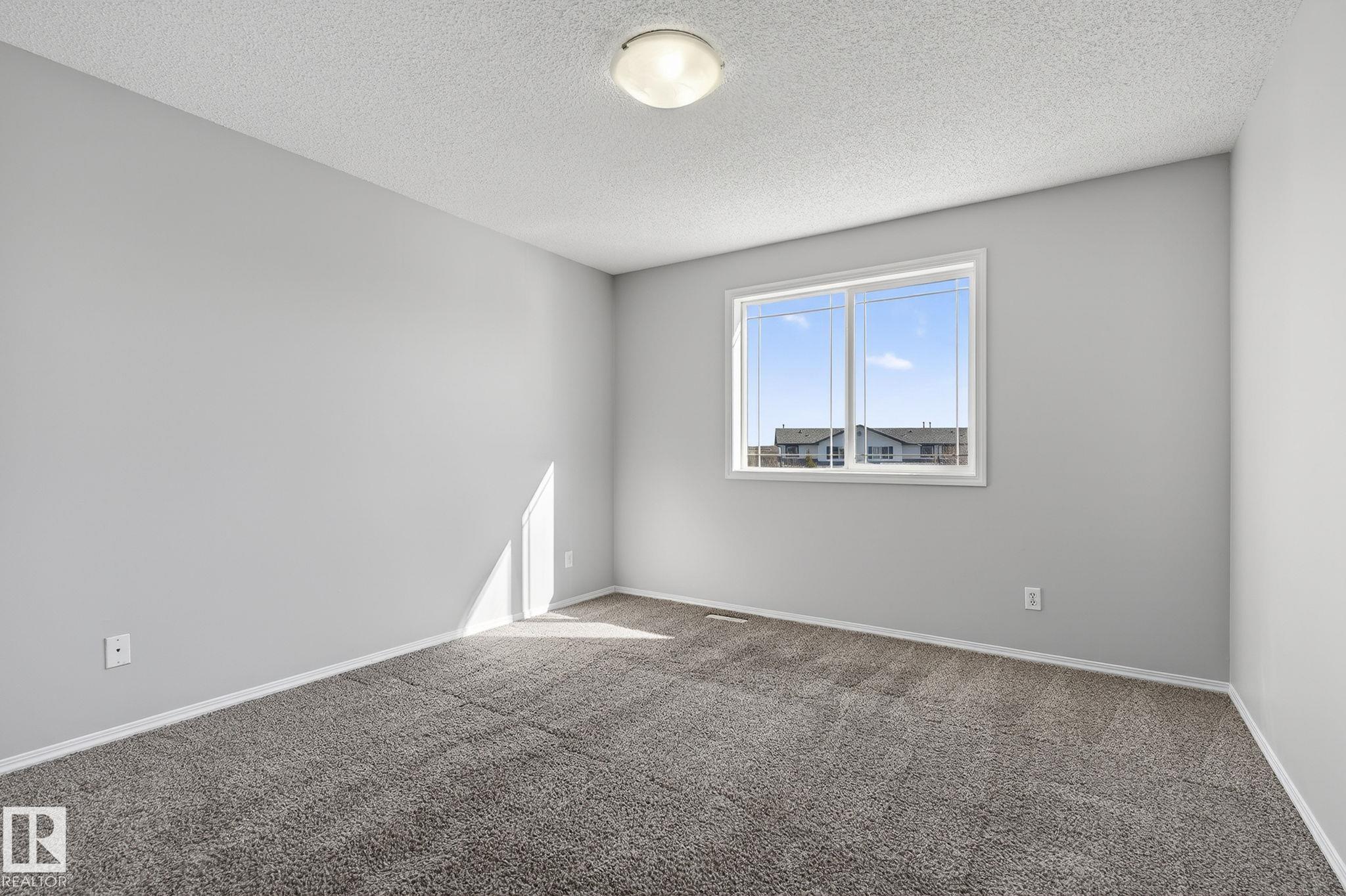 Photo 14 at 30 - 450 Hyndman Crescent NW, Canon Ridge, Edmonton