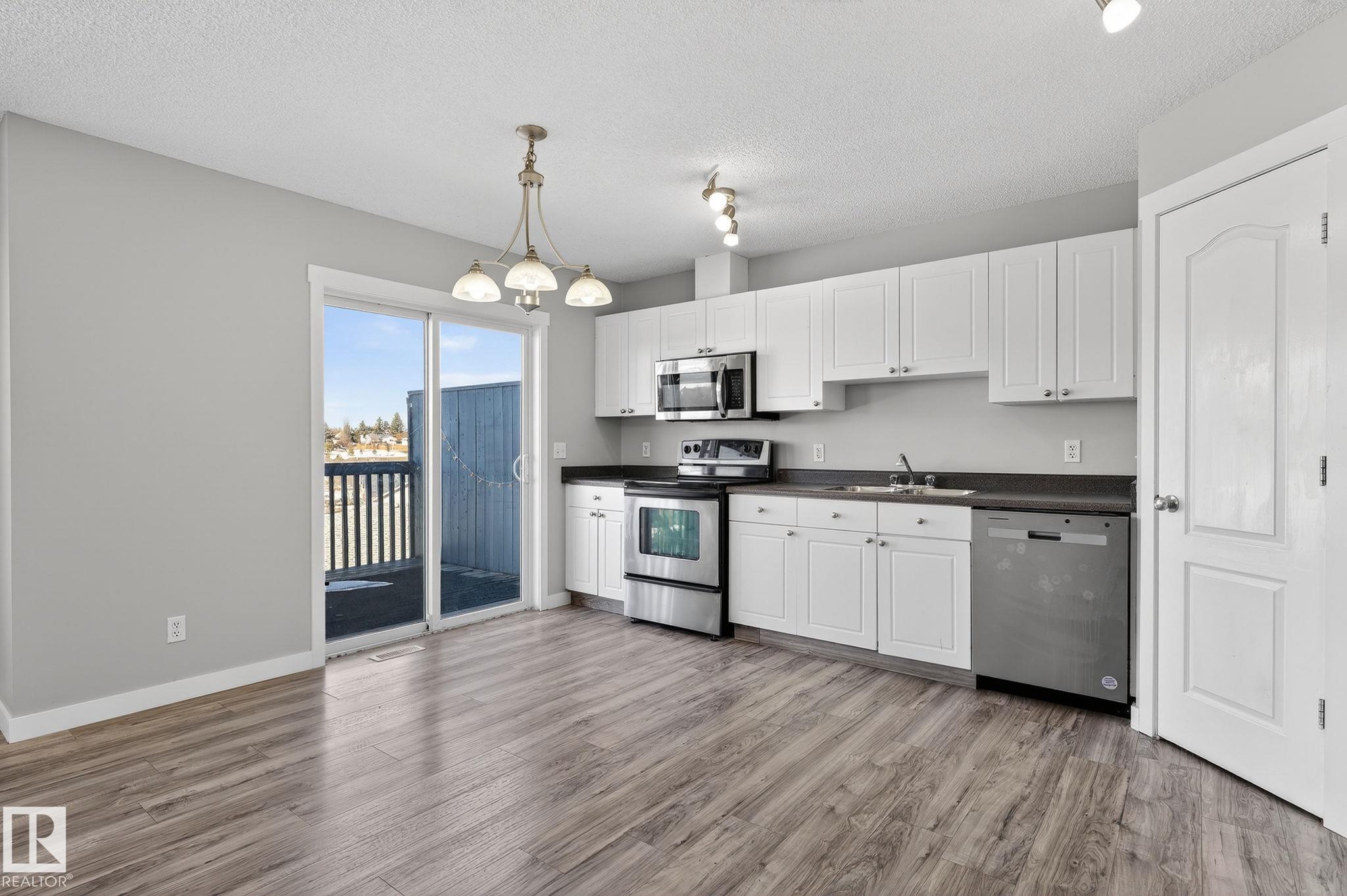 Photo 7 at 30 - 450 Hyndman Crescent NW, Canon Ridge, Edmonton