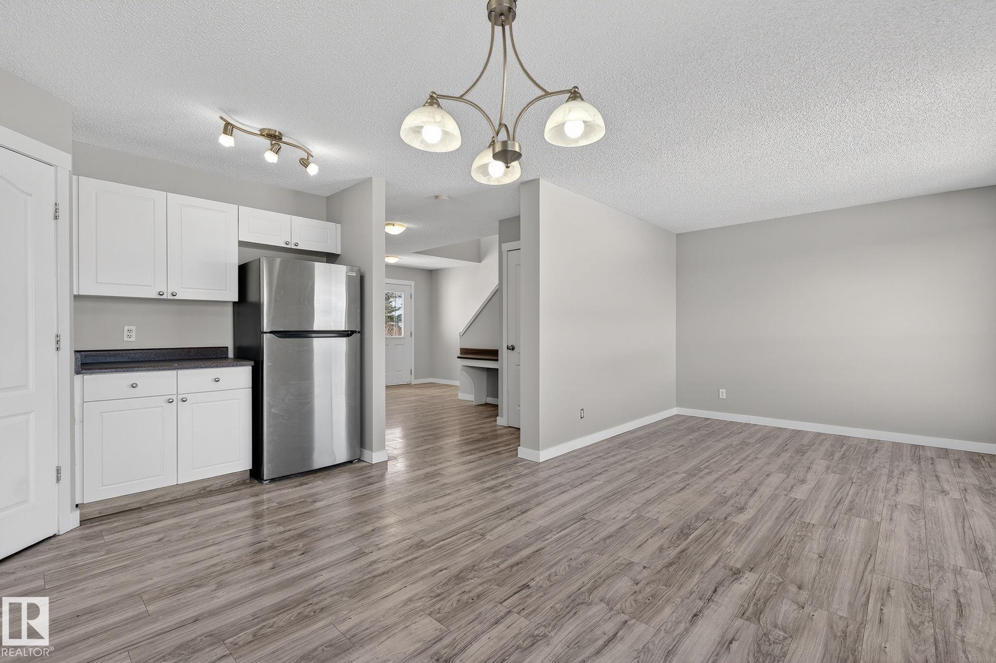Photo 9 at 30 - 450 Hyndman Crescent NW, Canon Ridge, Edmonton