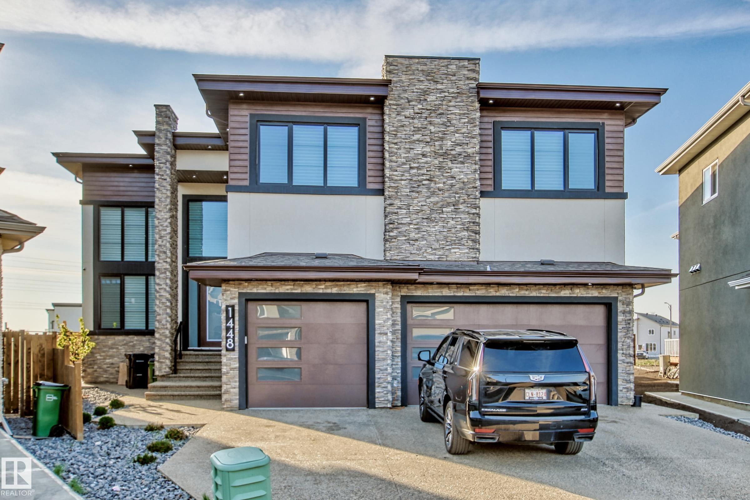 Experience the pinnacle of luxury in this 6,400+ sq. ft. architectural masterpiece, perfectly positioned on a premier estate lot. Curated by an award-winning designer, every inch of this residence radiates sophistication, from the dual grand parlors to the chef-inspired kitchen featuring industrial-grade ventilation. The upper level is a sanctuary for large families, offering six substantial bedrooms, six bathrooms, and a versatile loft, all managed by a smart automated blind system and full climate control. The lower level transforms into a private social club, boasting a professional cinema, fitness studio, custom bar, and guest suite. Unparalleled infrastructure defines this home, including a triple-car garage and a driveway equipped with hydronic in-floor heating for effortless winters. Step outside to a $60,000 professionally manicured oasis that opens directly onto a lush community park. This rare multi-generational gem represents a level of refinement and privacy seldom found on the market.