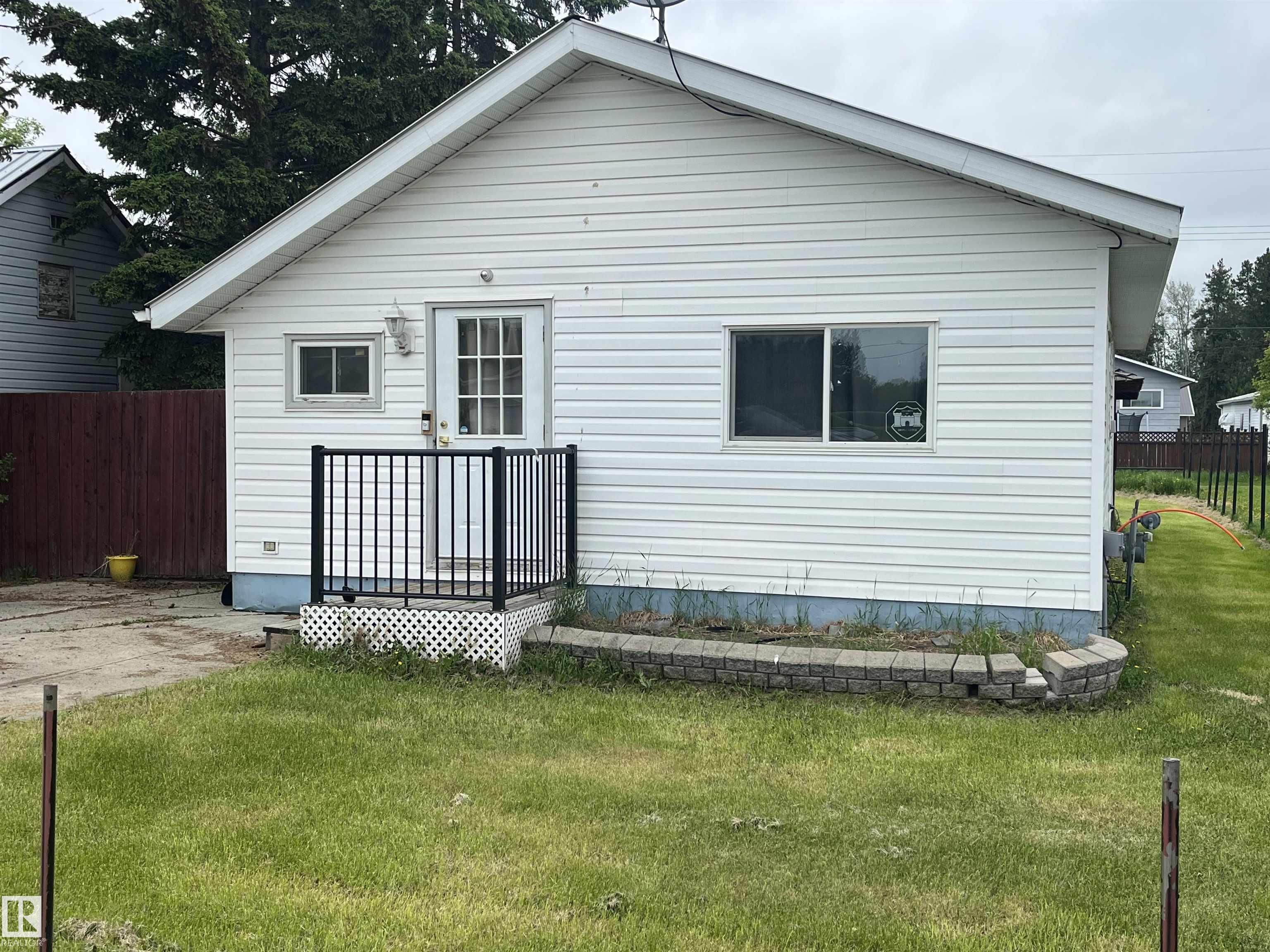 Cute & cozy... here it is!!! This 2 bedroom 1 bathroom home in Wildwood is ready for a new owner. It has a very bright & open kitchen, dining and living room concept. Outside features a concrete parking pad in the front, a large backyard with a couple sheds. Posts for a fence are in but you do the fence as you please. This charming home is conveniently located close to the school, park, shopping, and just minutes from Chip Lake Park.