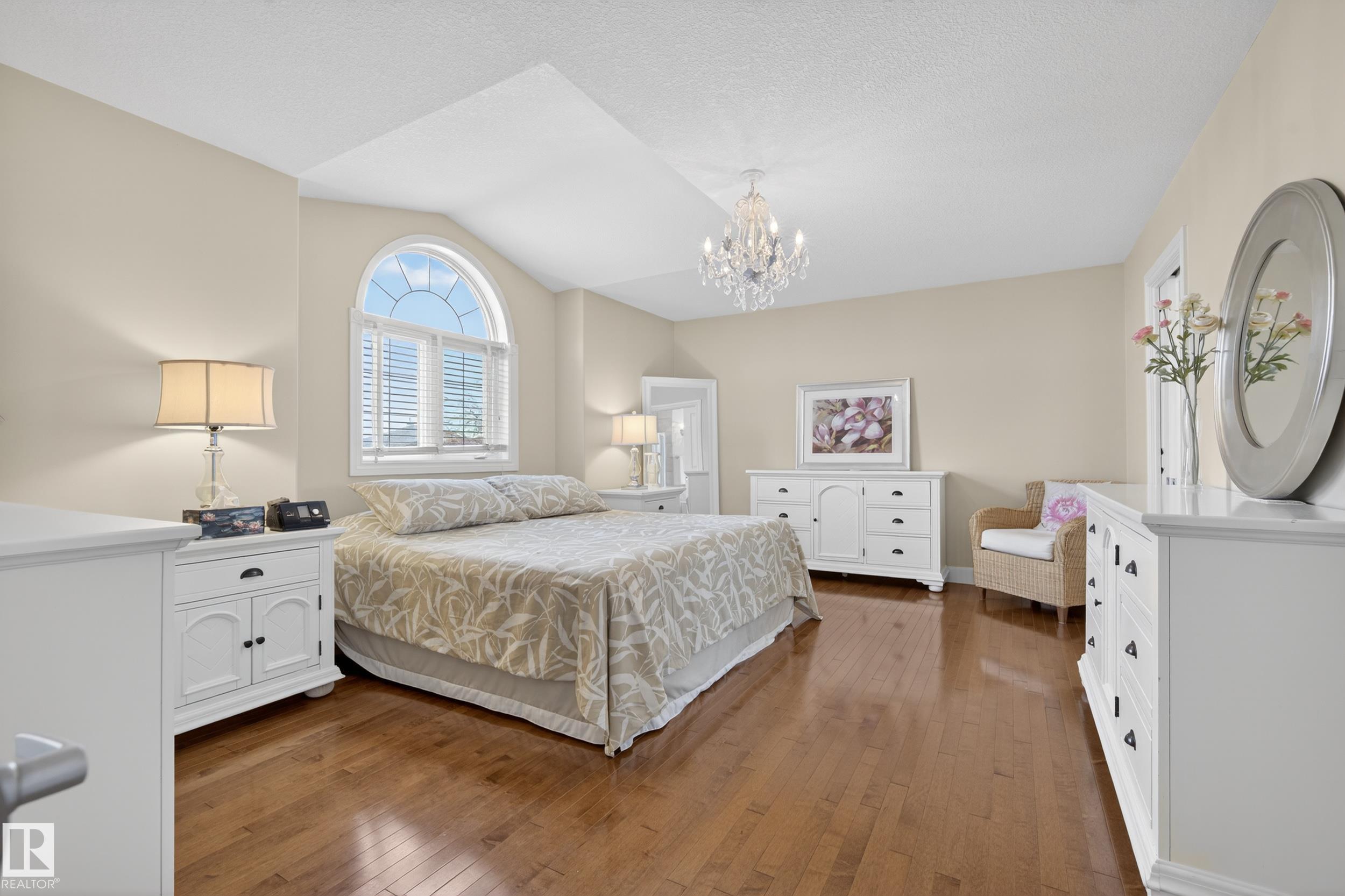 **NEW** Furnace, A/C, Hot Water Tank & Shingles! This stunning 2-storey 4Bedroom 1Den 4 Bathroom home sits on a large, beautifully landscaped lot in a quiet, family-friendly neighbourhood. Featuring a triple attached garage, oversized driveway with RV parking, a grand staircase, open-to-below living room, chef-inspired kitchen, main floor laundry, and a rare main floor bedroom or home office. The fully finished walkout basement offers heated floors and exceptional additional living space, making it perfect for large families or entertaining. Meticulously maintained and truly move-in ready, this is a home you won't want to miss.