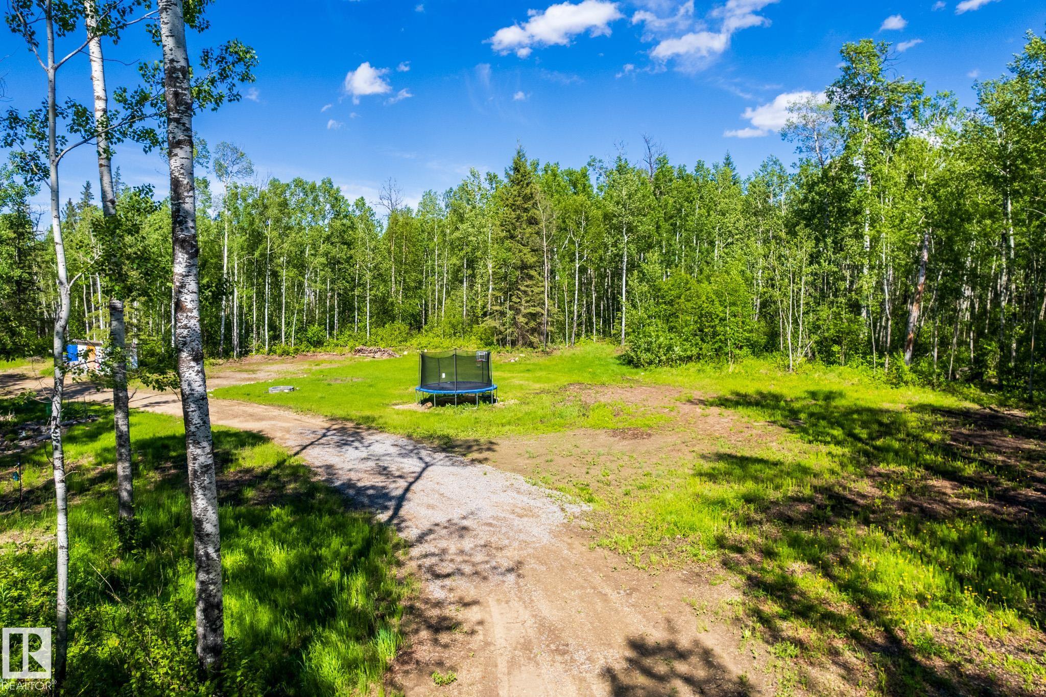 Discover the tranquility of Belle Vista Estates with this beautifully treed 2.46-acre property, offering privacy, natural surroundings, and endless possibilities. Whether you're planning to build your dream home, create a peaceful weekend retreat, or invest in future potential, this property is ready for your vision. A drilled well and power were added in 2025, saving you time and expense as you begin your plans. Enjoy the perfect balance of seclusion and convenience, located just 20 minutes from Onoway, 30 minutes from Stony Plain, and 40 minutes from Edmonton. Escape the city and embrace the lifestyle you've been looking for in this serene rural setting.