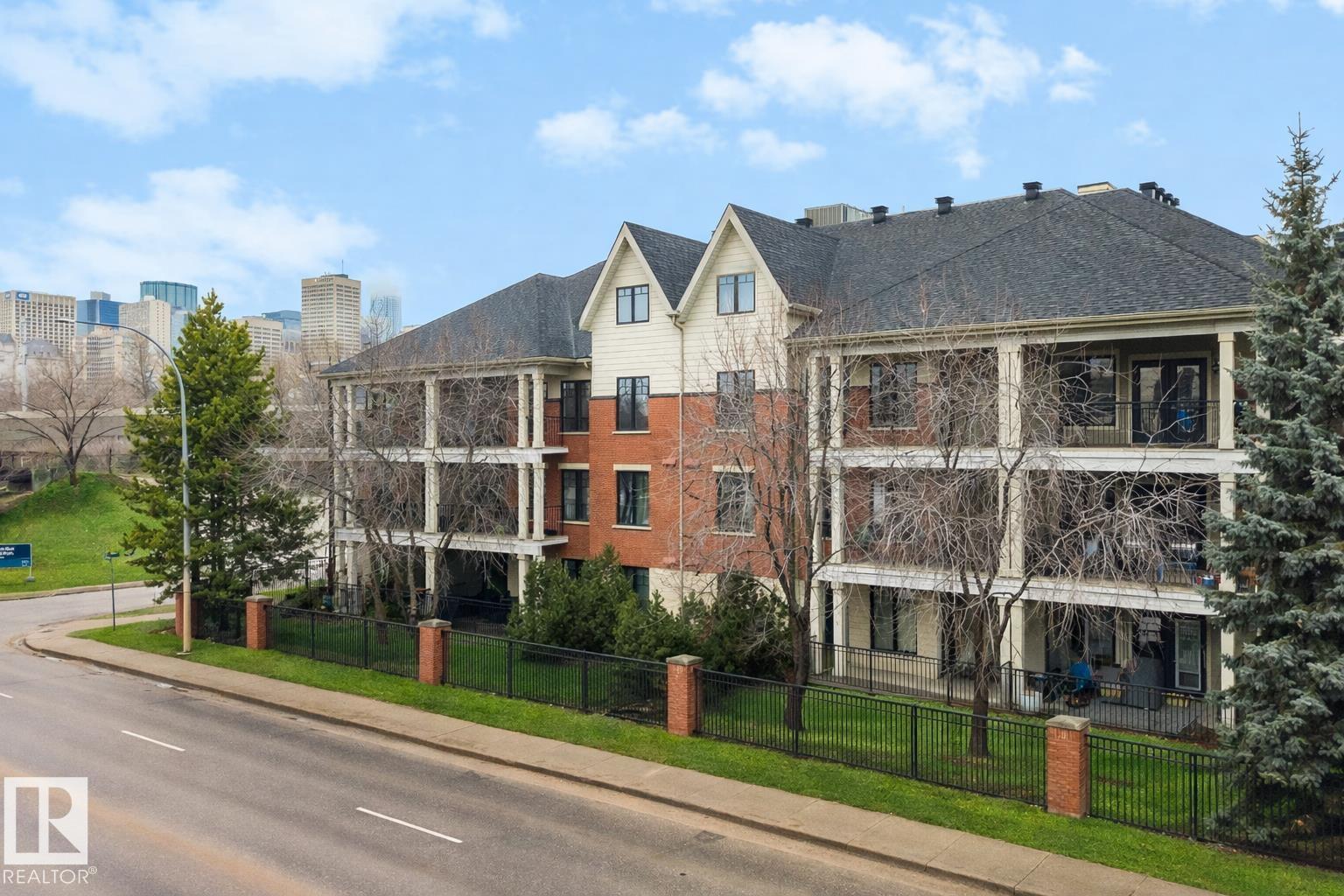 Located in a well-kept condo community beside Edmonton?s river valley, this top-floor home at The Landing offers a rare blend of comfort and immediate access to nature, with scenic trails functioning as your extended backyard. The suite provides over 1,100 square feet of single-level space with an open layout and warm Kempas hardwood flooring in the main living area. The kitchen includes cherrywood cabinets, granite countertops, stainless steel appliances, and a walk-in pantry, while a gas fireplace, upgraded lighting, and air conditioning enhance everyday living. The spacious primary bedroom features 20-foot vaulted ceilings, a walk-in closet, and an ensuite with a custom walk-in shower. A large deck with a gas hookup, underground parking, and access to the building?s fitness room add convenience, and with public transportation close by, this home offers both natural beauty and urban accessibility.