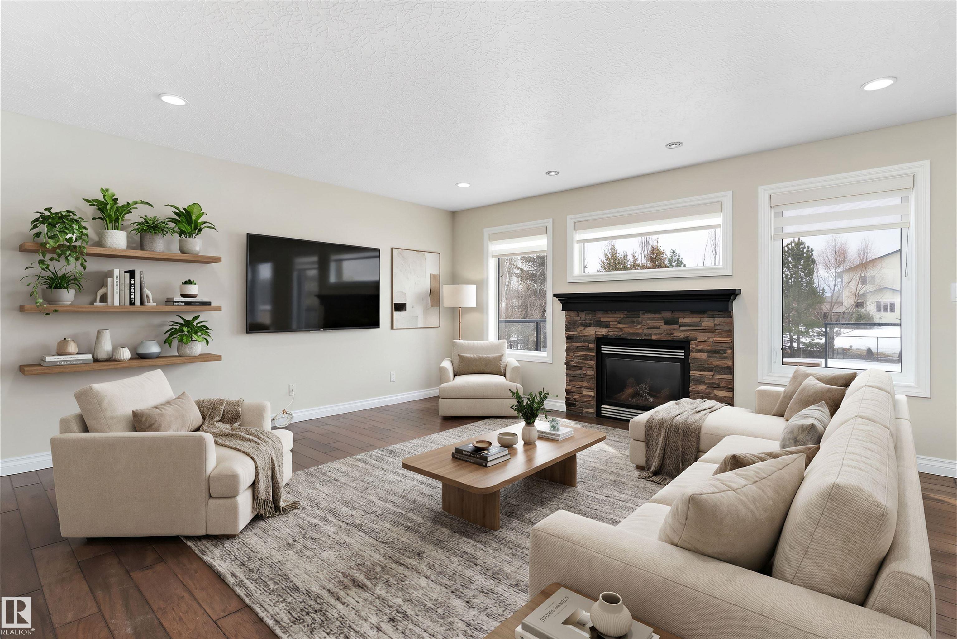 Step into luxury in this impeccably finished residence where craftsmanship meets sophisticated design. The open-concept main floor creates an inviting atmosphere, highlighted by the flow of engineered hardwood and premium tile. The stylish kitchen beckons with granite countertops and stainless appliances. Retreat upstairs to a sprawling bonus room with a cozy gas fireplace and a primary suite featuring a luxurious 5-piece ensuite. The finished basement is an entertainer's dream, complete with a modern bath, wet bar with beverage cooler, and a second fireplace. Discover the unique charm of a hidden room - perfect for a wine cellar or hobby space. The heated triple attached garage features custom cabinetry. Step outside to your expansive deck, an ideal backdrop for summer gatherings. Complete with A/C, water softener, and on-demand hot water, this home is truly move-in ready. Don?t miss this incredible opportunity to own a home where every detail has been thoughtfully curated!