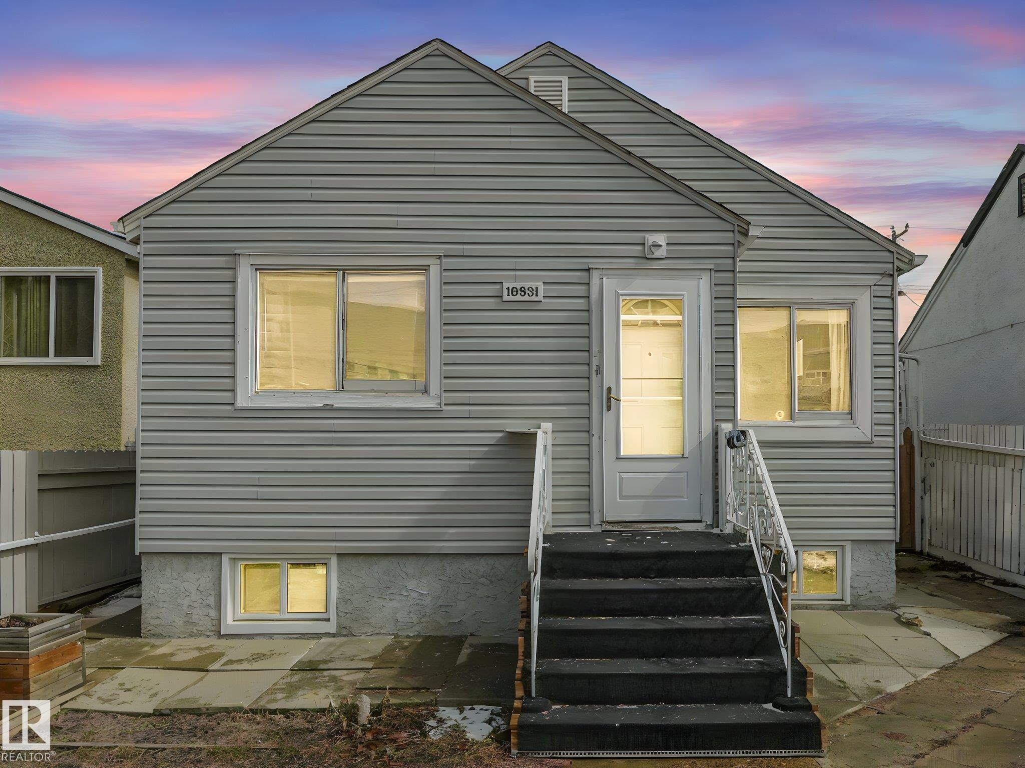 Welcome to this fully furnished property in a prime central location?perfect for investors or first-time home buyers. Situated within walking distance to the Royal Alexandra Hospital, public transit, shopping, dining, schools, and all the conveniences of downtown living.The main floor features two comfortable bedrooms, a cozy kitchen, a bright living area, and a full bathroom. A separate side entrance leads to the basement, offering additional living space with a bedroom or flex area, another full bathroom, and a spacious laundry and storage area.This property presents excellent income potential, whether long-term or short-term.The large lot is a standout feature, complete with a shed, double fence doors for RV parking, and plenty of space to build a large garage. There is also exciting potential for future redevelopment, including the possibility of commercial infill (subject to municipal approval). Reasonably priced and full of opportunity?this property is ready for its next owner!