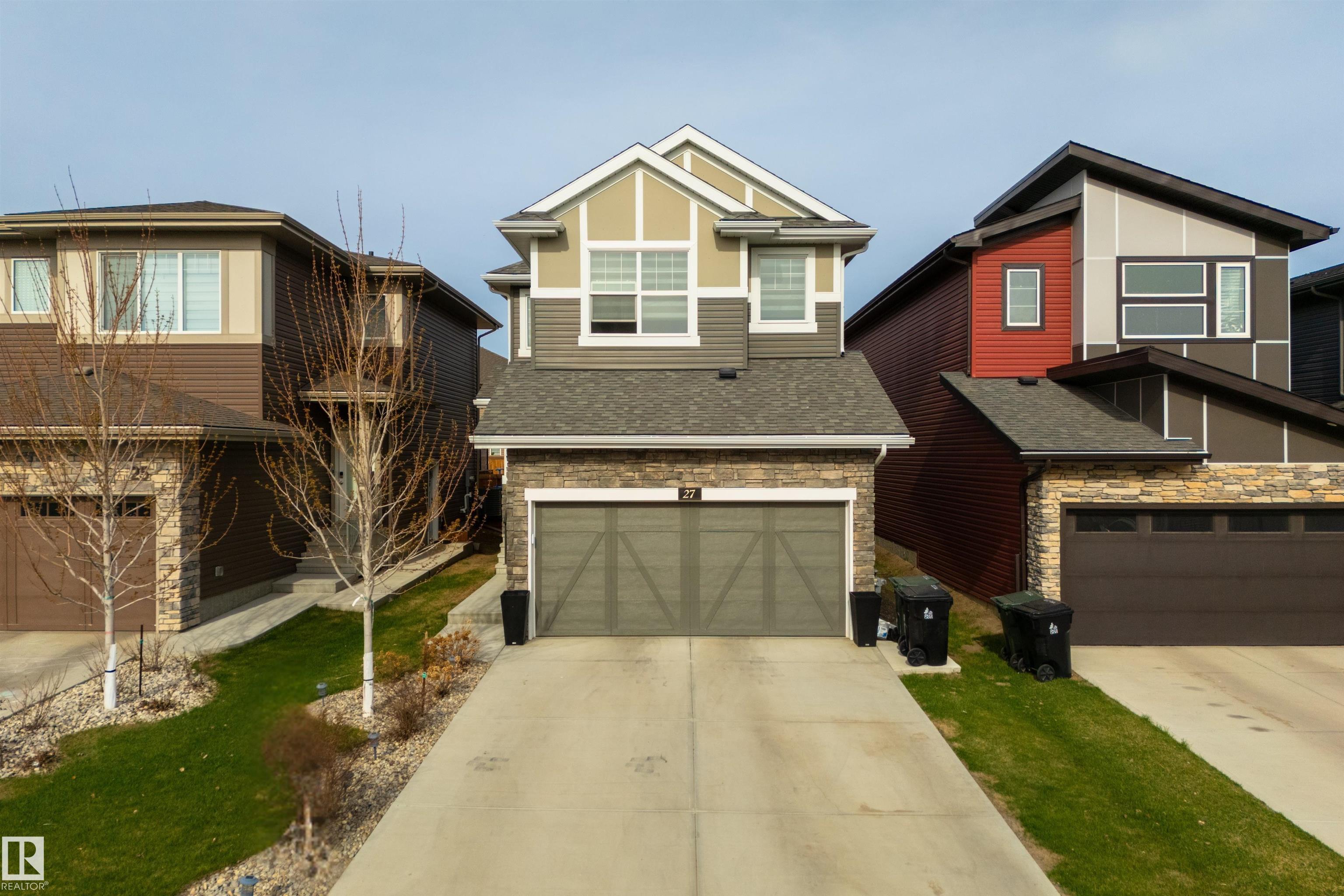 Perfect location in Prescott ? minutes to Jubilee Park!  Beautifully finished with a unique layout, this home features 9? ceilings, central A/C, luxury vinyl plank flooring, lovely kitchen with full-height cabinetry, quartz countertops, stainless appliances, separate dinette, and a walk-through pantry leading to the mudroom area off the HEATED double-attached garage, cozy living room with stone-facing fireplace, top-floor bonus room, upstairs laundry, 4pc bath, & generous-sized bedrooms including a HUGE king-sized owner?s suite with walk-in closet & adjoining 4pc ensuite.  Outside the yard is beautifully landscaped & fenced with a covered ground-level patio & desirable WEST-FACING exposure.  Within walking distance to playgrounds, trails, schools, & shopping, this is the ideal family home!