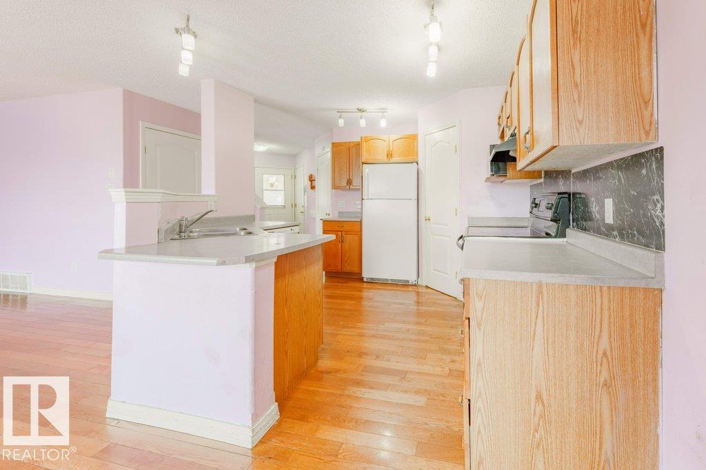 Photo 13 at 2144 37b Avenue NW, Wild Rose, Edmonton