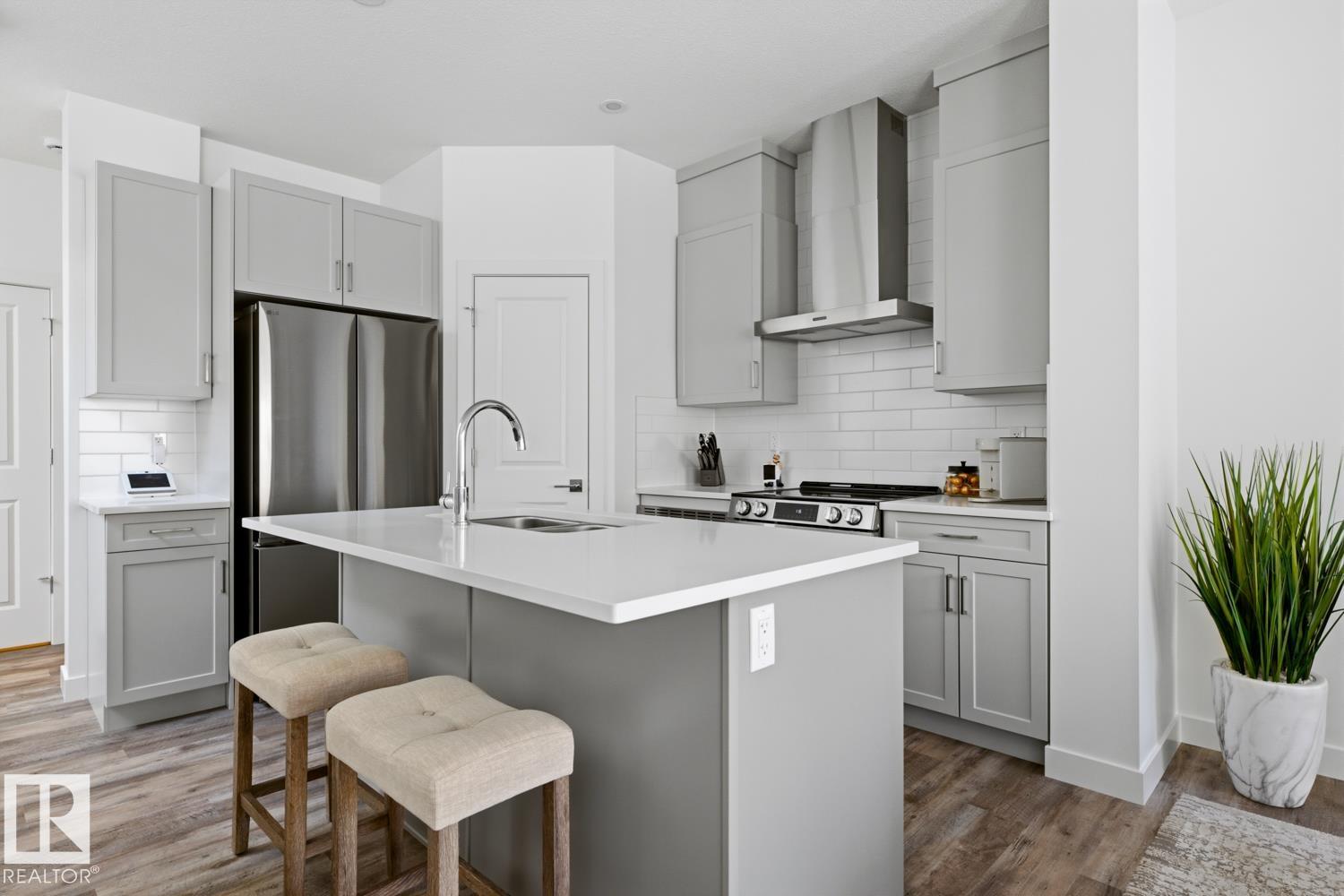 Photo 17 at 19 - 5122 213a Street NW, The Hamptons, Edmonton