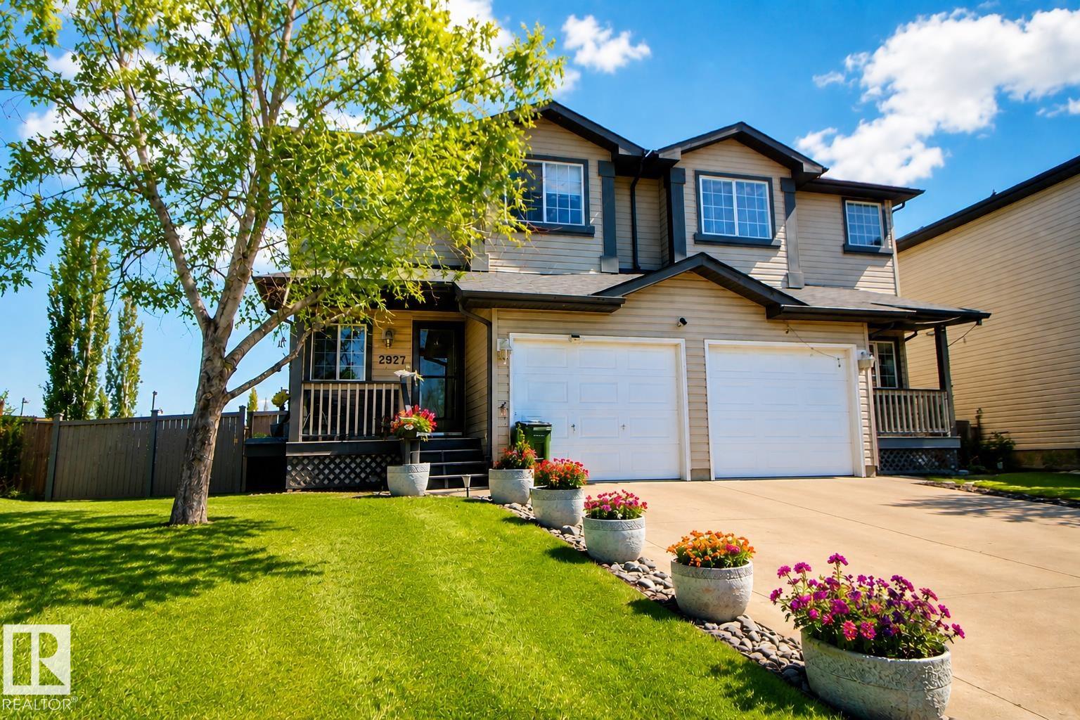 Welcome to Silver Berry & this unique 2-storey duplex, offering over 1,694 sq ft of total finished living space with 1,331 sq ft above grade, all situated on a massive pie-shaped lot backing onto greenbelt & walking trails. This home features 2 very spacious bdrms & 2 baths. The main floor featuresa an open-concept layout with a bright living room highlighted by a fireplace, a cozy dining area, & a functional kitchen with ample cabinetry. A bonus flex room addition (2009) provides stunning views of the park-like backyard oasis. The exterior is accented with stone for added curb appeal. The finished basement includes a family/games room. Recent updates include newer washer, fridge, central air conditioning, & shingles replaced in 2024. Enjoy the lrg deck accessed through patio doors, beautifully landscaped grounds,  rock garden, mature trees, & garden shed for extra storage. BRAND NEW  Furance! Close to schools, shopping, transit, parks, and major roadways like Whitemud & Anthony Henday.
