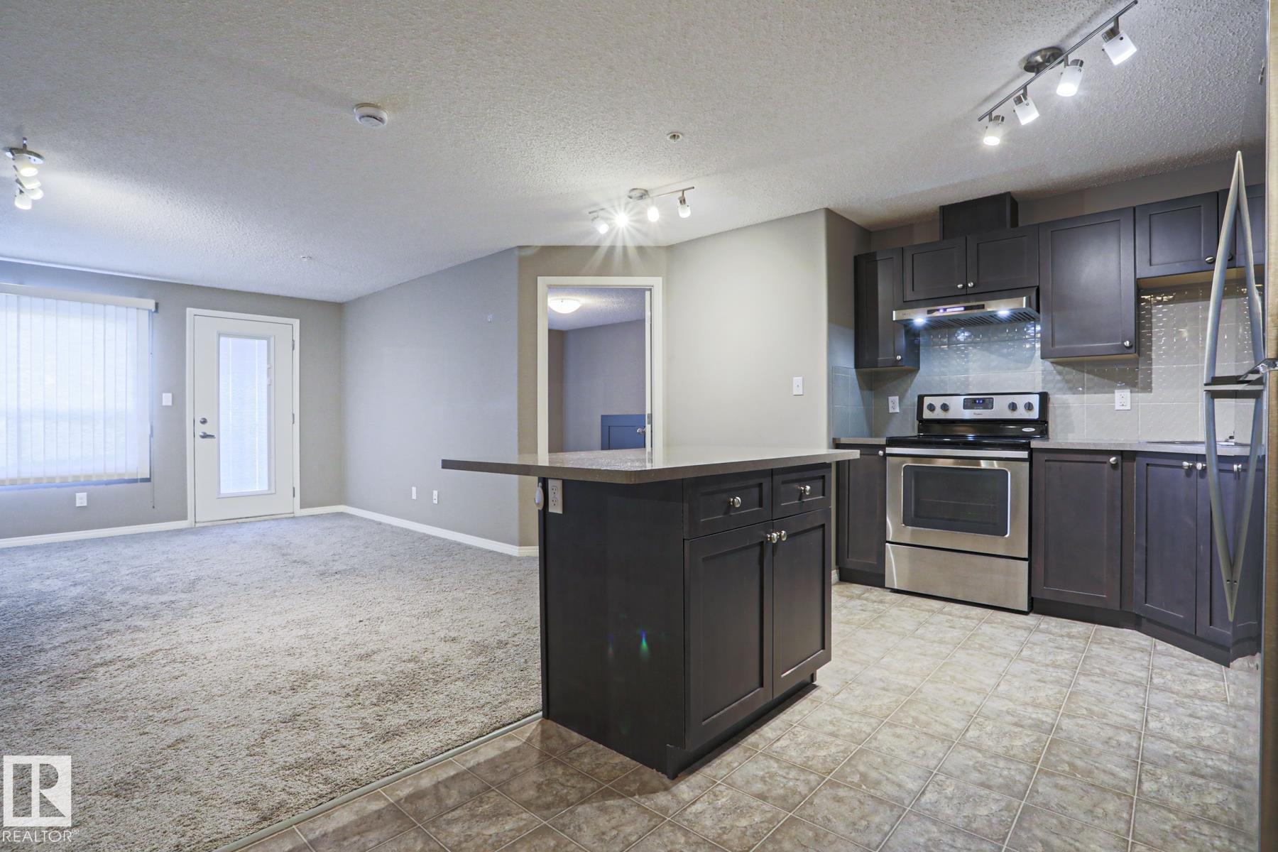 Photo 2 at 201 - 1520 Hammond Gate NW, The Hamptons, Edmonton