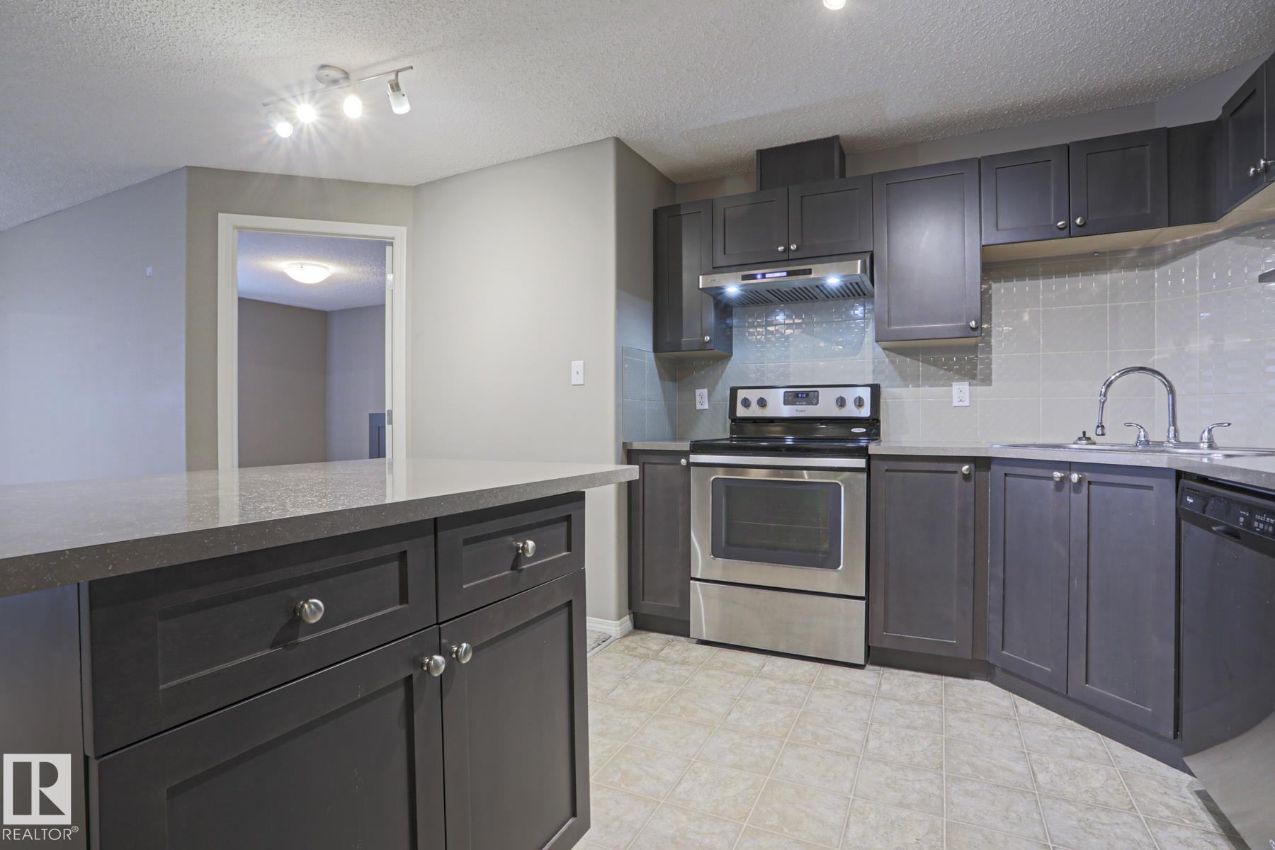 Photo 4 at 201 - 1520 Hammond Gate NW, The Hamptons, Edmonton