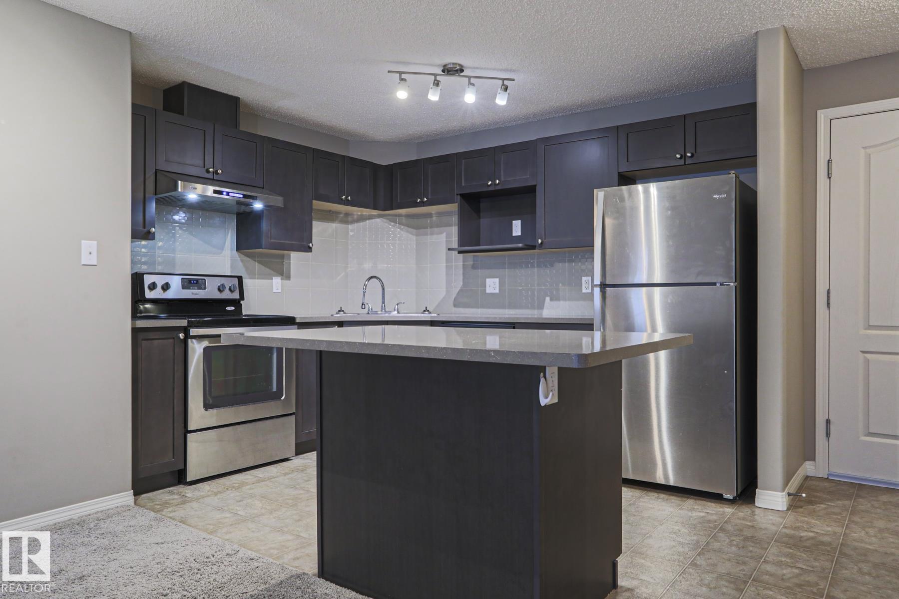 Photo 7 at 201 - 1520 Hammond Gate NW, The Hamptons, Edmonton