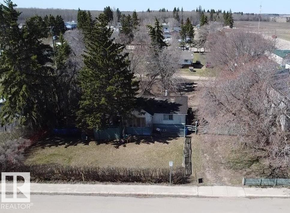 Invest Now! Double lot on Main Street with Hamlet General District zoning! Allows for discretionary multiple development options including single family, multi family, mobile and commercial. Fully Serviced with municipal services. Offers mature trees, concrete parking pad and back alley access. Close to convenient store, school and golf course. Just off Highway #28 and truck route. Between Bonnyville and Cold lake. Let the Building Begin! Property is being sold as-is, where-is. The existing structure is not considered habitable.