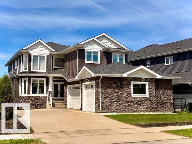 Welcome to this impressive two-storey home with a triple garage and expansive driveway. A grand foyer with a stunning waterfall feature creates an unforgettable first impression. Offering six bedrooms and four full bathrooms, this home provides exceptional space for growing families. The chef-inspired kitchen features high-end finishes, a large island, and opens to a deck overlooking the pond and beautifully landscaped backyard. Upstairs, the spacious primary suite includes a spa-style ensuite with steam shower, Jacuzzi tub, and two walk-in closets. The fully finished walk-out basement adds even more living space with a gym area, wet bar, gas fireplace, fresh paint, and brand-new carpet. A rare combination of space, comfort, and location.