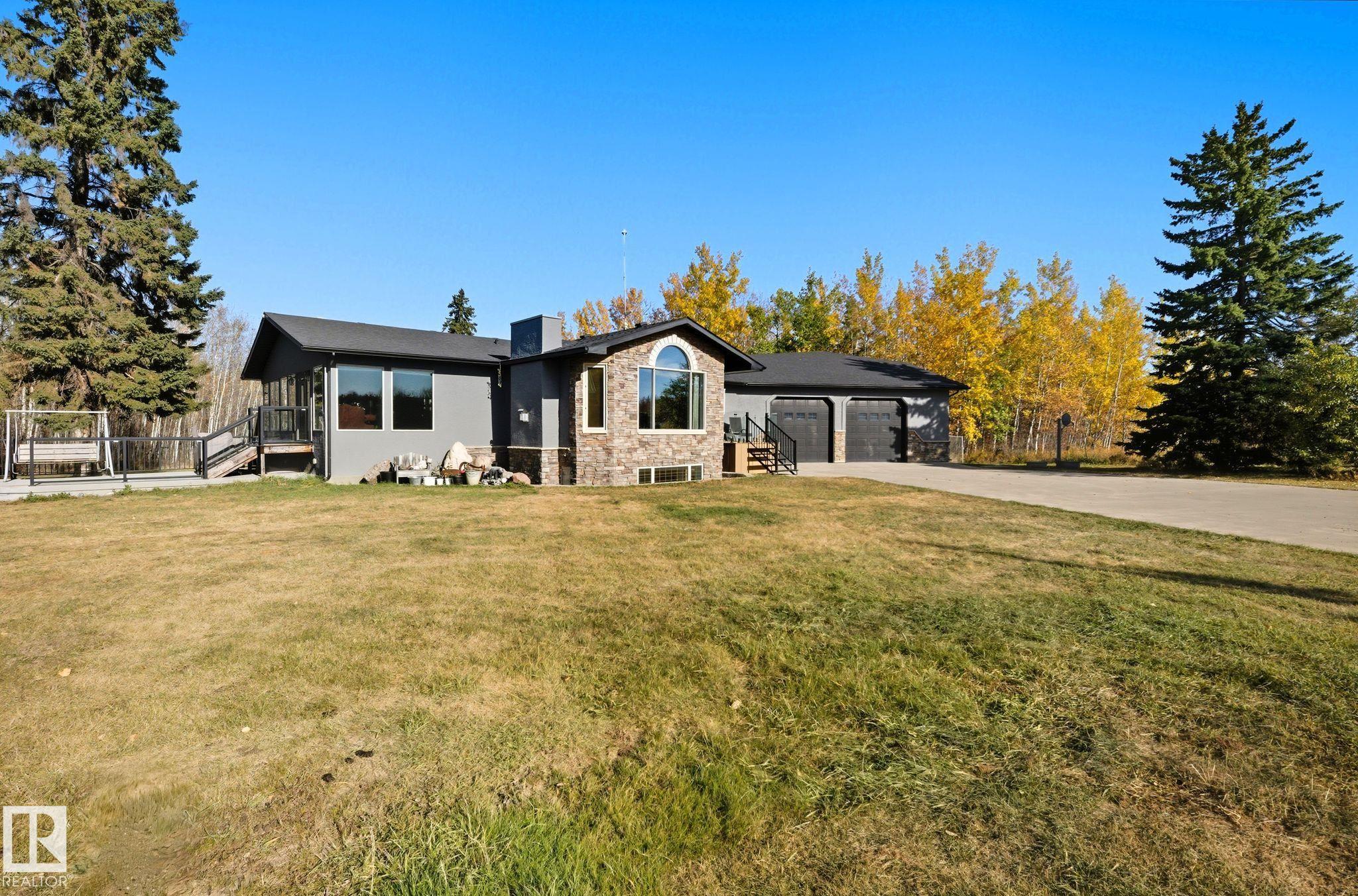 Welcome to your own 143-acre paradise! With two separate titles (4.87 acres + 138 acres), this incredible property offers privacy, recreation, and endless potential. Explore quad trails, mature bush, and abundant wildlife right in your backyard. Enjoy weekends at the cozy cabin, host family gatherings, weddings (county approval required), or create Airbnb retreats. The heated barn with 220 power, hay shed, and fenced land are ideal for animals or hobby farming. Inside, the home features 5 bedrooms, 3 baths, A/C, in-floor heated basement, and a stunning custom kitchen by Cabico.—a proudly Canadian-made product. Relax in your spa-like ensuite, unwind in the swim spa, or enjoy movie nights in the basement theatre. With a heated garage, fenced yard, and long treed driveway, this property truly has it all!