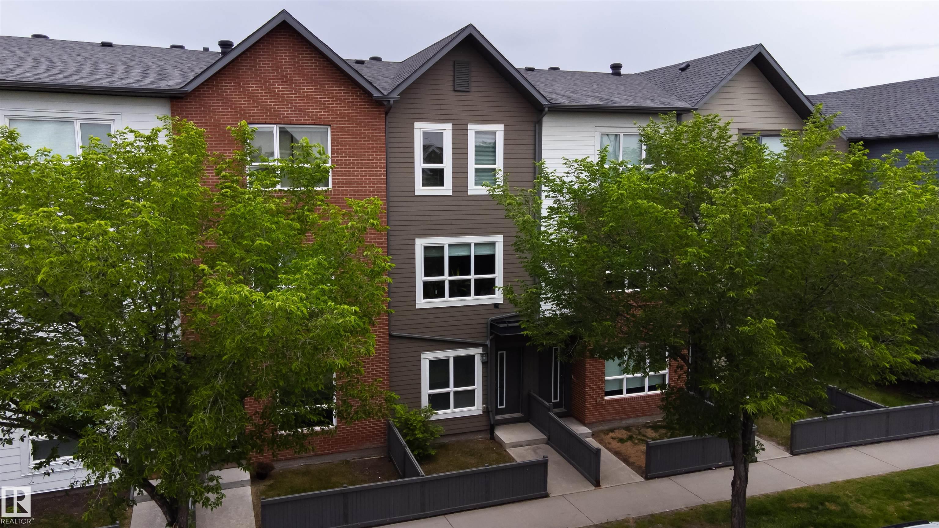 Welcome home! The perfect home for any 1st-Time Home-Buyer; Investory or Family. This 1,351 SqFt ThreeStorey Townhouse boasts a Single Attached Garage & is in great condition - Highly Upgraded including Granite Counters throughout! Located in the heart of Griesbach, this is the home for you. The 9' main floor has Laminate plank flooring & large windows to allow for much natural light. The gorgeous kitchen has UPGRADED high-end cabinets/soft-close drawers; a huge island & S/S appliances. The Dining Room takes you to the spacious Living Room where you can enjoy those cozy movie nights. Patio doors lead you outside to the deck where you can enjoy the sun! The Upper floor has 2 Bedrooms including a large Primary Bedroom with double closets. A Main Bathroom with plenty of counterspace & a convenient Laundry Room complete this floor. The Lower level has a Den (potential for Bedroom) & a 1/2 Bathroom. Enjoy extensive walking-trails to community amenities (outdoor workout area/future rink); parks; playground.