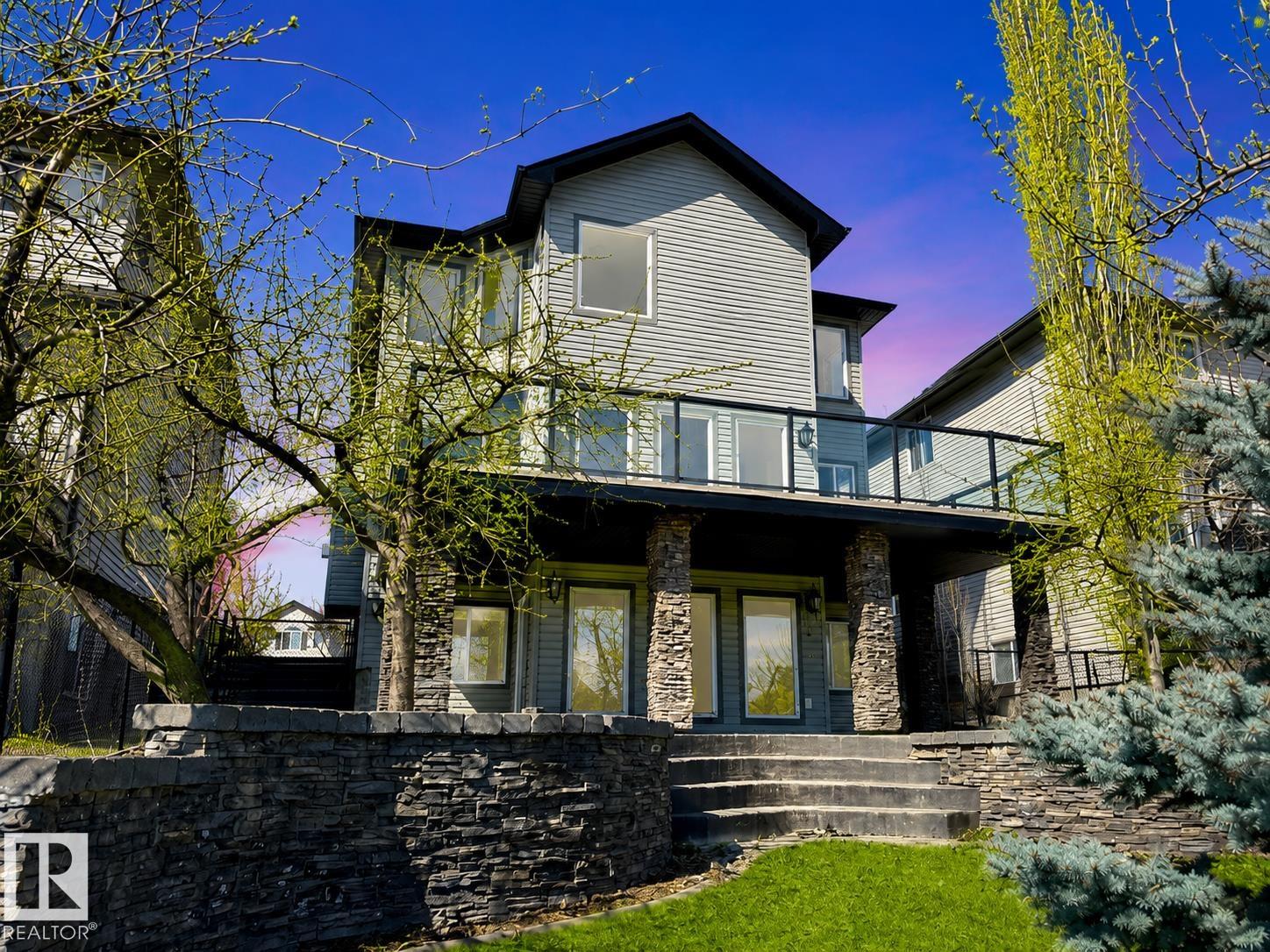 This walkout 2-storey backs onto a lake in Summerwood! Set in one of the community?s most desirable locations, this spacious home offers room for the whole family with 5 bedrooms, 4.5 bathrooms, and beautiful year-round views. The main floor features a welcoming layout with a formal dining area and built-in cabinetry, while the upper level offers a large bonus room plus an impressive primary suite with walk-in closet and 5-piece ensuite with soaker tub and separate shower. The fully finished walkout basement adds 2 additional bedrooms, ideal for guests, teens, or extended family. Recent improvements include fresh paint throughout, brand new carpet, air conditioning, hot water on demand, a replaced furnace in 2024, and new Duradeck covering in 2025. Complete with a double attached double garage and a private lake-backing setting, this is a rare opportunity to enjoy space, comfort, and views in sought-after Summerwood. *some photos are virtually "Staged."