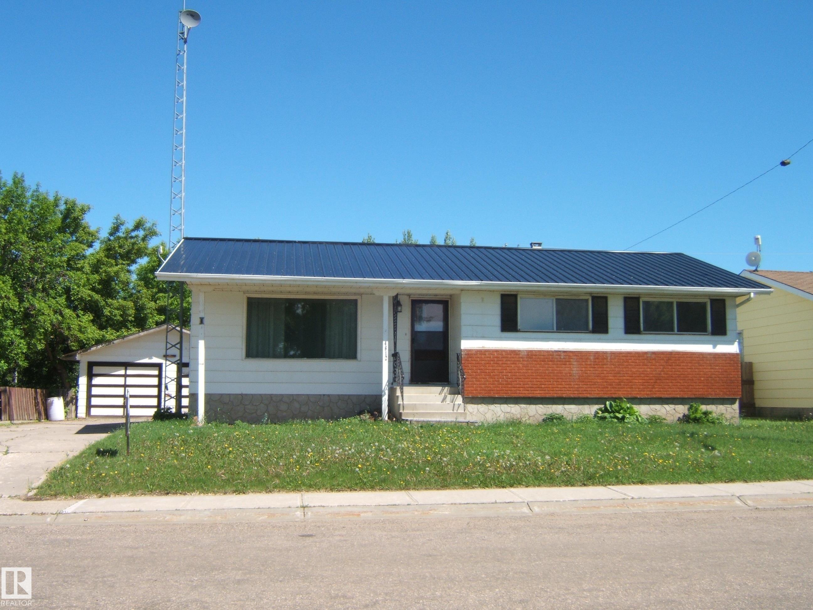 1976, 3 +1 Bedroom Home with a Detached 529 sq. ft. Garage in the Friendly Community of Two Hills. Features of Home Include, Metal Roof, Main Floor Laundry, Laminate Flooring,  Primary Bedroom with 2 Piece Ensuite, 2 Additional Bedrooms on Main Floor, 4 Piece Main Bathroom, Kitchen, Dining Room and a Spacious Living Room. Basement is Finished with Family Room, Bedroom, 3 Piece Bathroom , Cold Room and Utility Room. Large 7813 sq. ft. Fenced Lot Features Oversized 2 Car Garage, Grassed Area, Room for a Garden and Room to Park Your RV etc. Great Location as Walking Distance to Most Amenities and Only a 5 Minute Drive to the Renown Two Hills Golf Course. Must View Property!