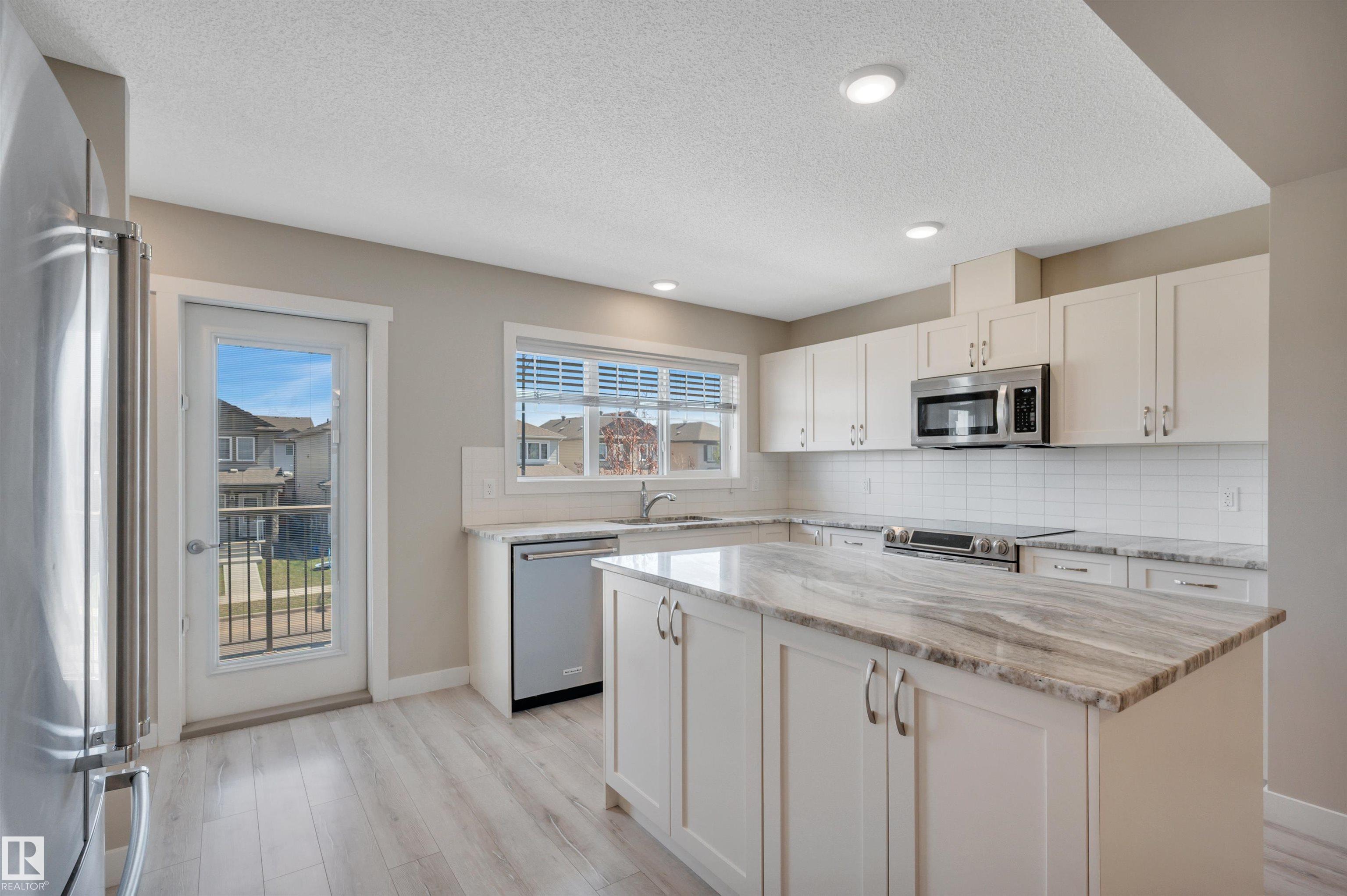 Photo 11 at 8 - 1530 Tamarack Boulevard NW, Tamarack, Edmonton