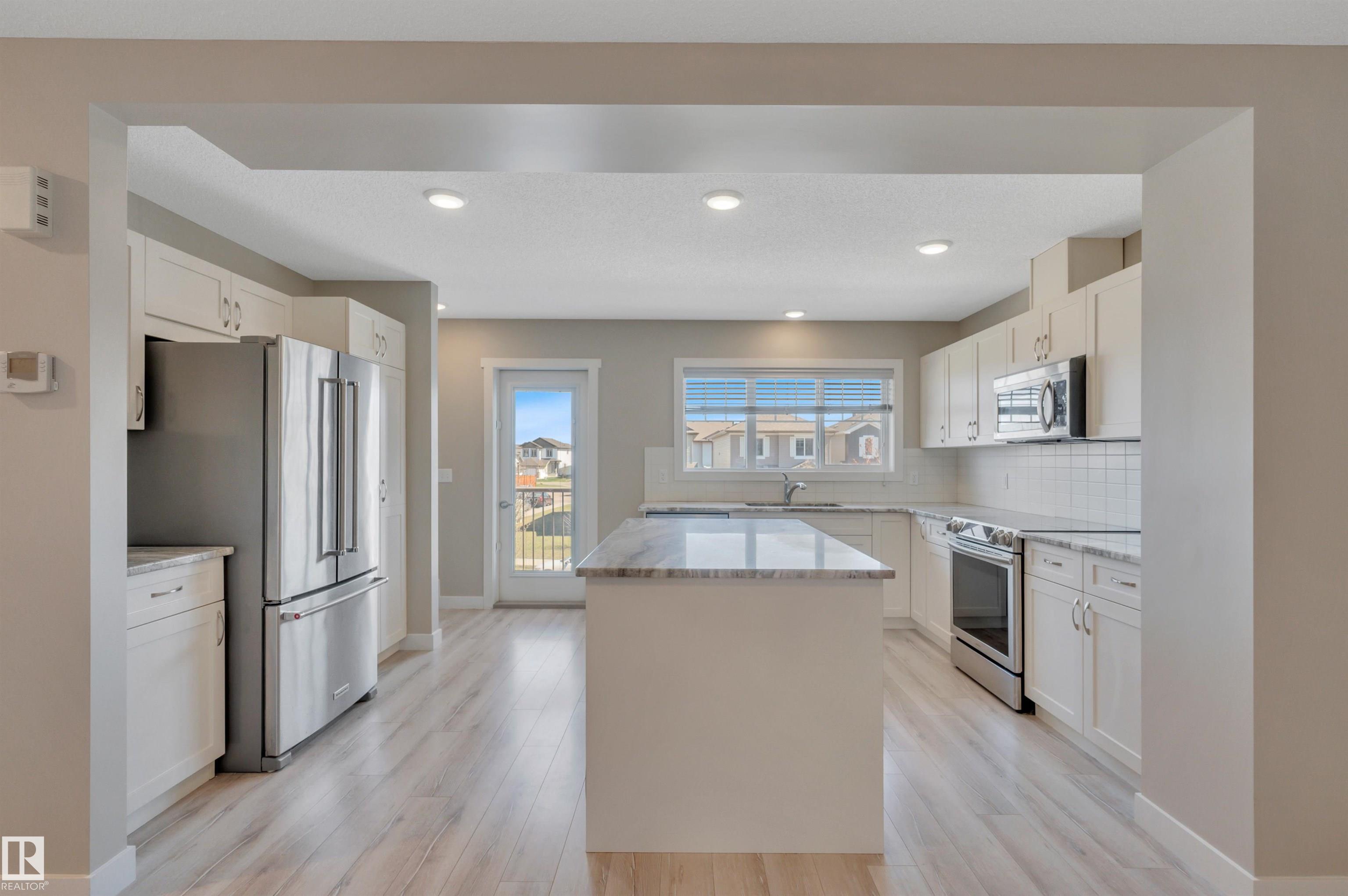 Photo 12 at 8 - 1530 Tamarack Boulevard NW, Tamarack, Edmonton