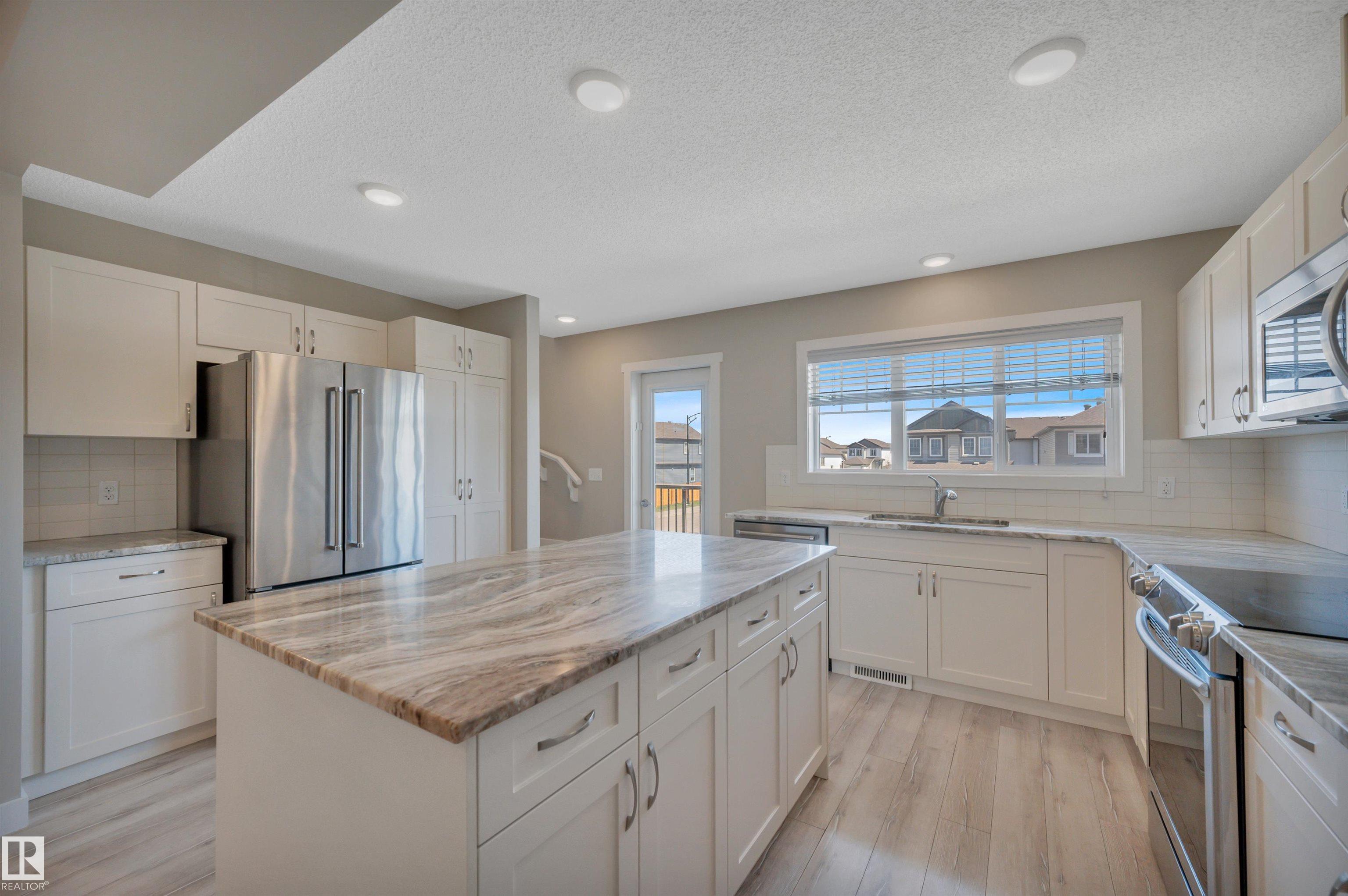 Photo 13 at 8 - 1530 Tamarack Boulevard NW, Tamarack, Edmonton