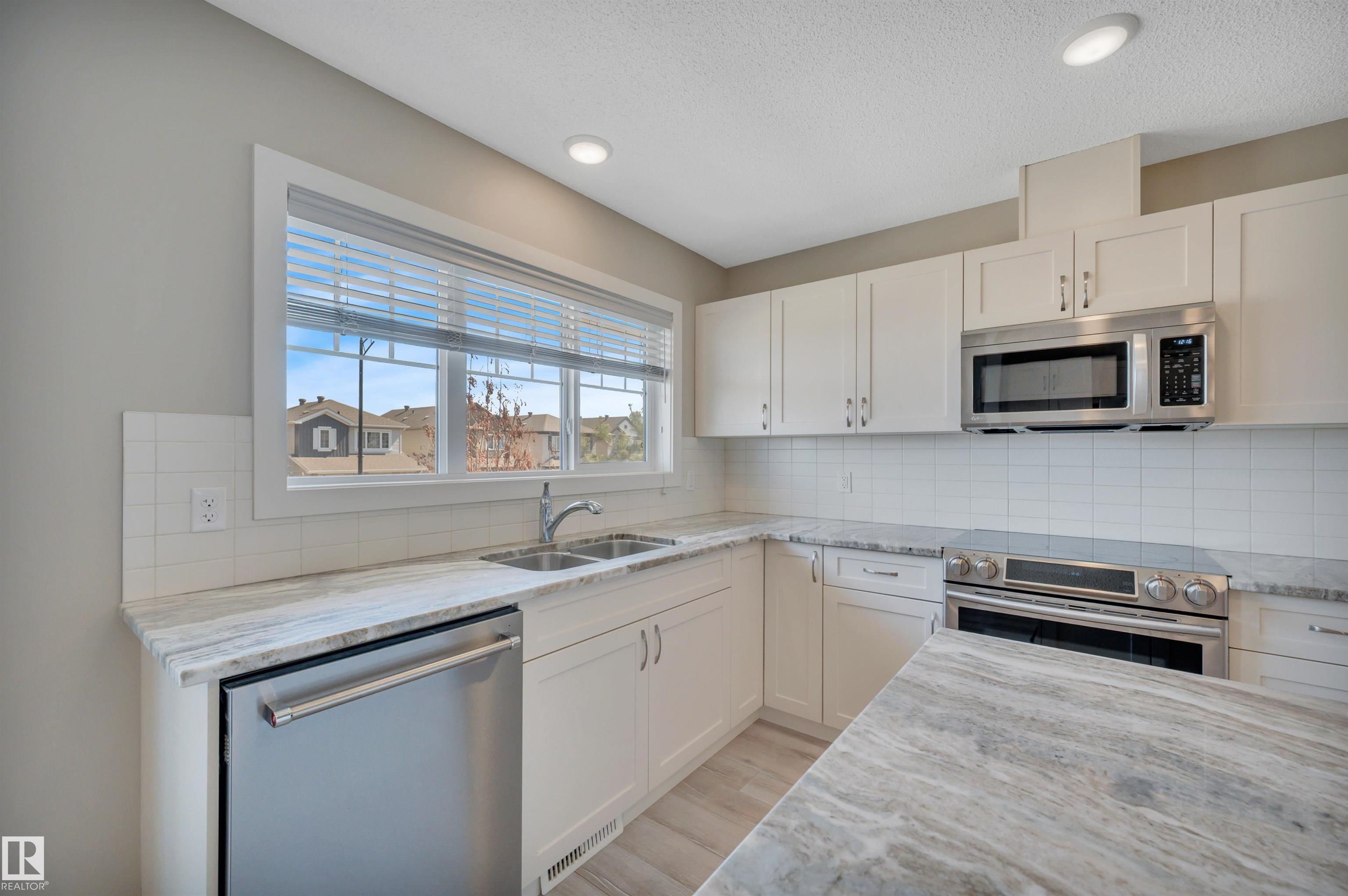 Photo 15 at 8 - 1530 Tamarack Boulevard NW, Tamarack, Edmonton