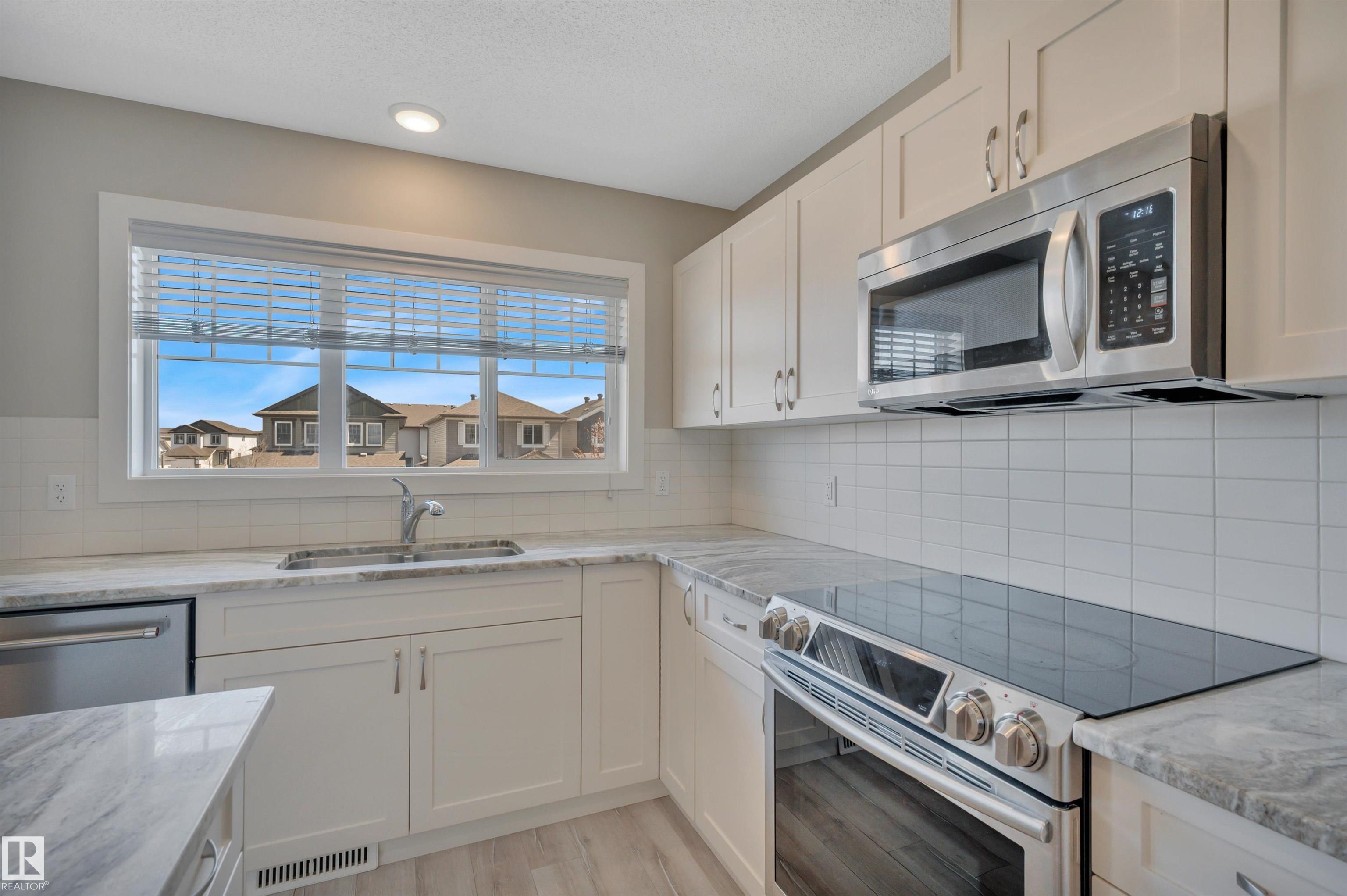 Photo 16 at 8 - 1530 Tamarack Boulevard NW, Tamarack, Edmonton