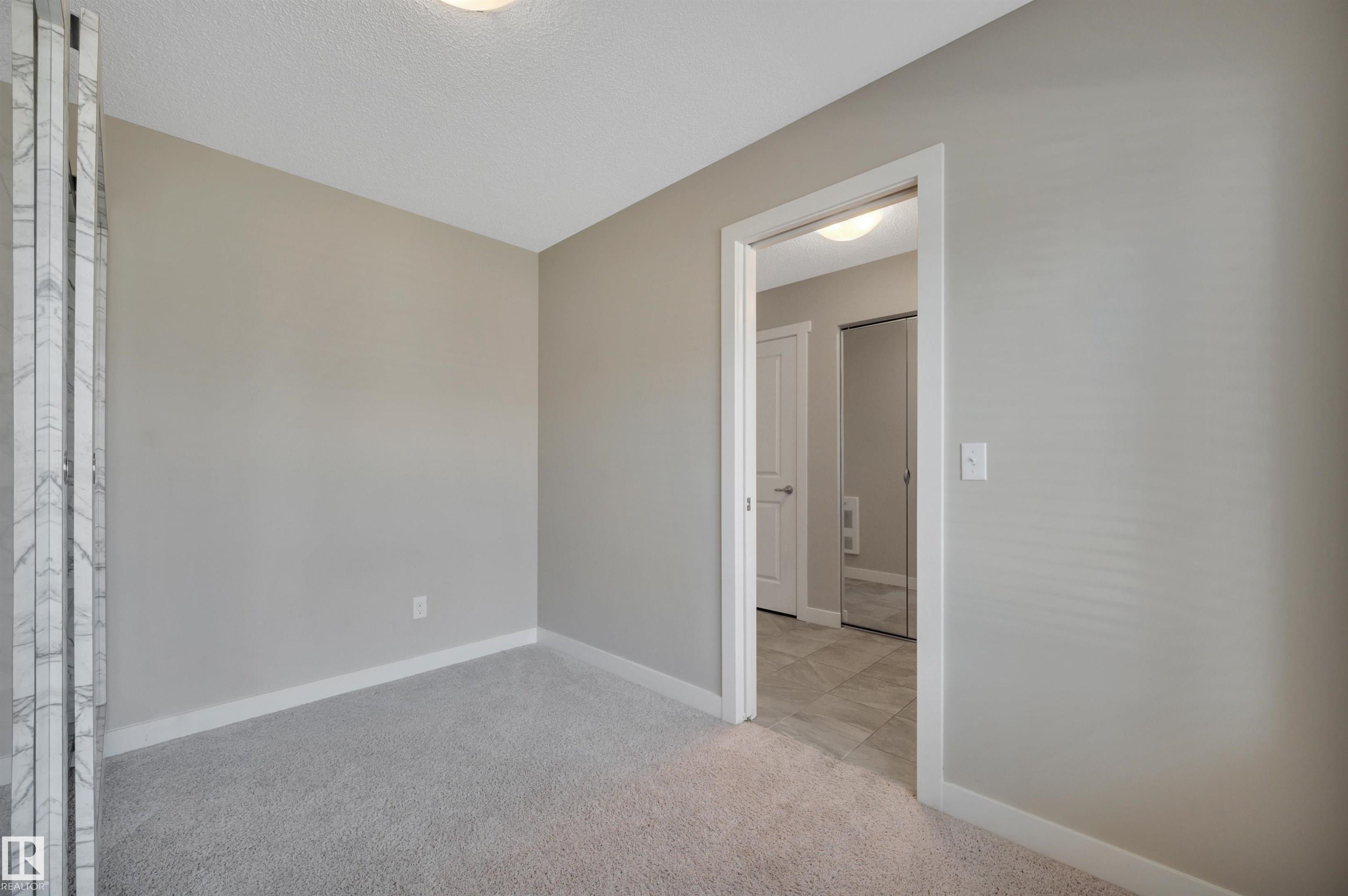 Photo 9 at 8 - 1530 Tamarack Boulevard NW, Tamarack, Edmonton