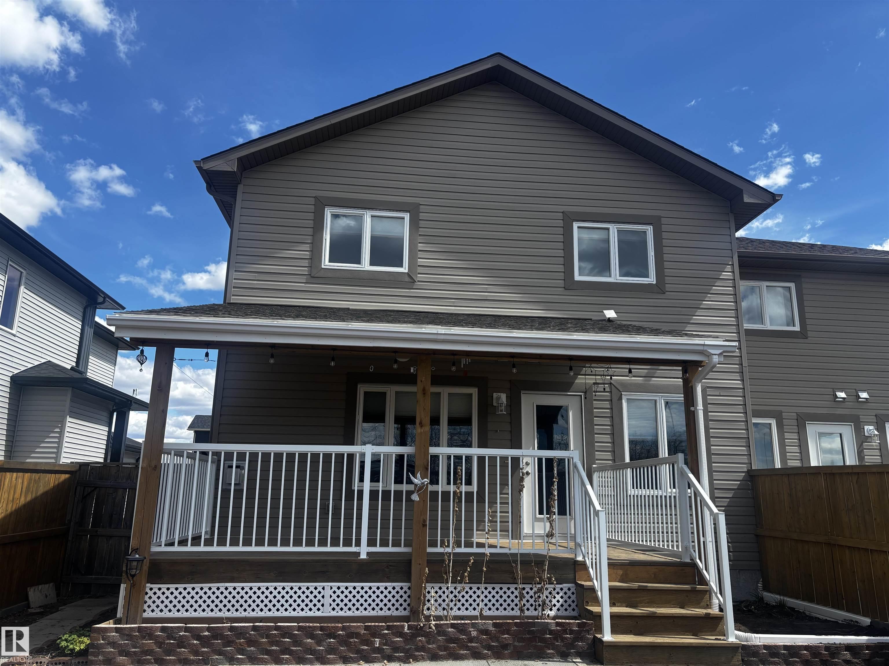 Welcome to a beautifully kept, half a duplex in the peaceful Town of Redwater. Enjoy the open-concept layout that connects the kitchen and living room, highlighted by a cozy gas fireplace, large windows, and a door that opens to a spacious covered deck. The kitchen features ample cabinetry and modern stainless-steel appliances. Upstairs, you?ll find a spacious primary bedroom with an ensuite, along with two additional bedrooms. The finished basement provides a generous family room perfect for entertaining, a dedicated crafts area, and a large TV room. Recent upgrades include a NEW AIR CONDITIONER, stylish blinds, A COVERED DECK, and redesigned landscaping in a west-facing backyard that?s fully fenced, complete with apple trees and new soil. The town offers a health centre, an ambulance service, a recreation facility, an outdoor pool, restaurants, shopping, and the Redwater Community Golf Club, as well as public schools from K-4 and 5-9. Make this wonderful house your new home!