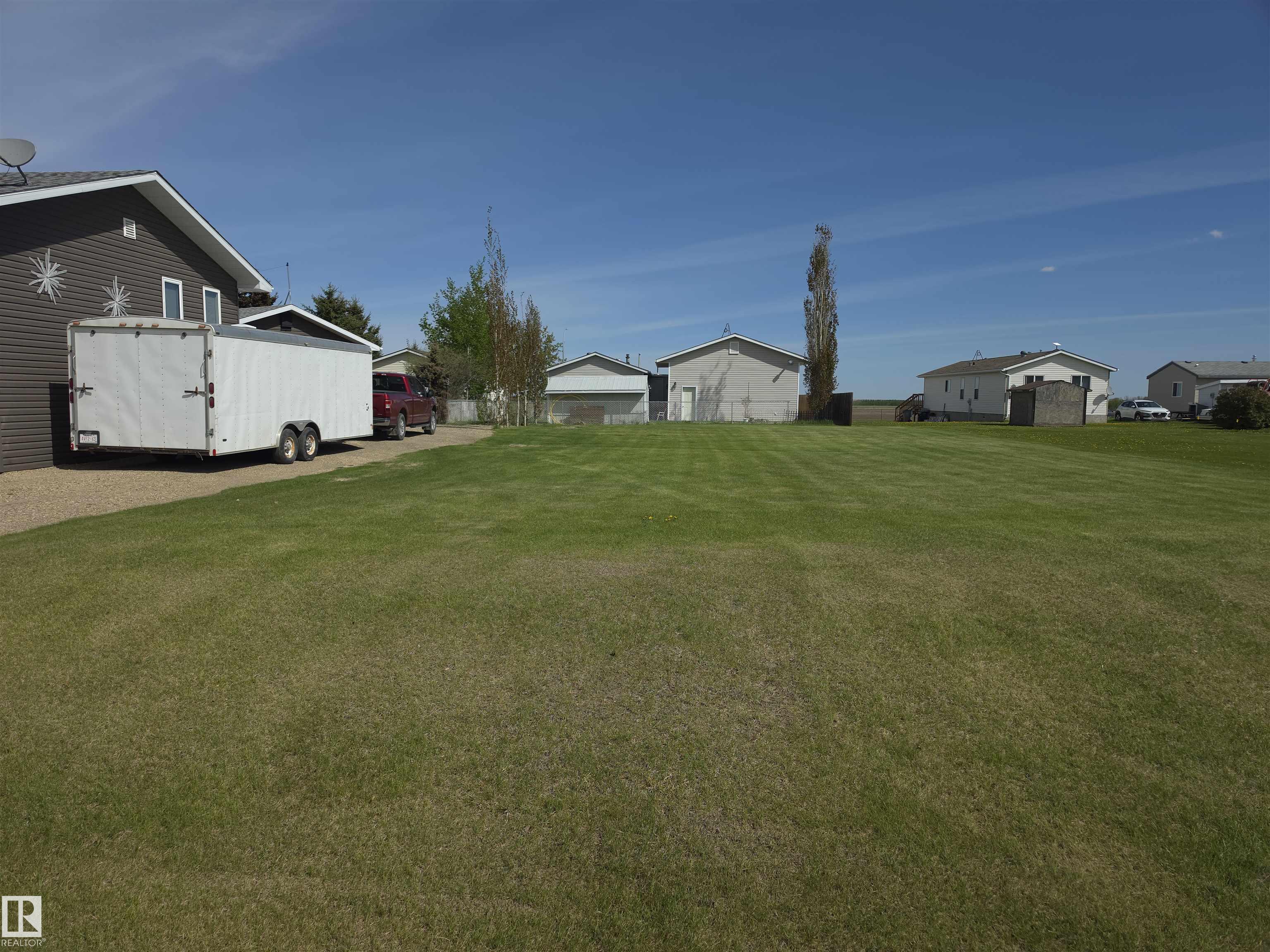 Build your dream home on this beautiful 50' x 120' residential lot located in the welcoming village of Warburg. This well-maintained property features lush, manicured grass, offering both charm and the opportunity to design your yard as you imagine.  Situated in a quiet, family-oriented neighbourhood, the lot is bordered by an established home on the West side of the yard and a vacant lot on the East side. The property is conveniently located less than a 10-minute walk to local schools. Enjoy small-town living with the perfect opportunity to create the home you?ve always envisioned.