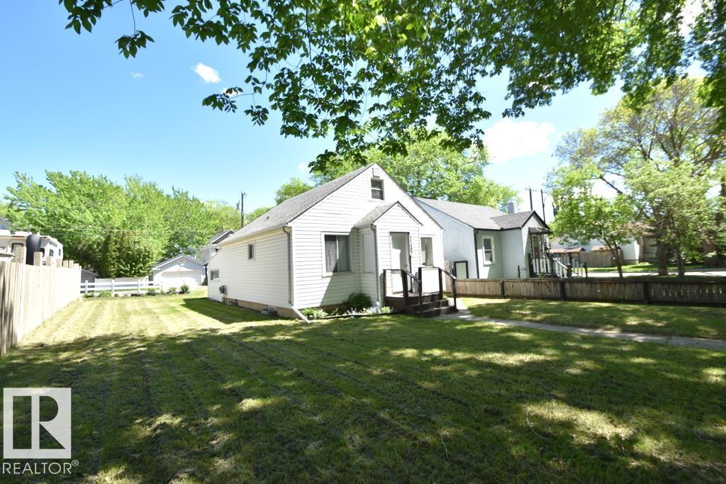 RIVER VALLEY OPPORTUNITY (oversized lot) in the desirable Bellevue / Highlands area! This 1939 home is absolutely LIVEABLE now, solid, and offers great potential for a flip or future rental investment if you are handy, or a future infill. Main floor has a compact kitchen, liv room w/ sunset views, 2bdrms, 3-piece bath w/ tile shower. Upstairs has a 3rd bdrm space, while the bsmt has a 4th room(den), laundry, flex space, storage & utilities. *all systems in great working order* UPDATES INCL: new HWT, 100amp service w/ upgraded elec, 8yr old furnace, 5 yr old roof x2! Large yard has single garage w/ back alley access & parking, garden & covered back deck w/ enclosure. Located just blocks from the river valley trails, parks, shops  & restaurants, and directly across from a liesure ctr/pool & high school. This property combines character, location, and future potential!
