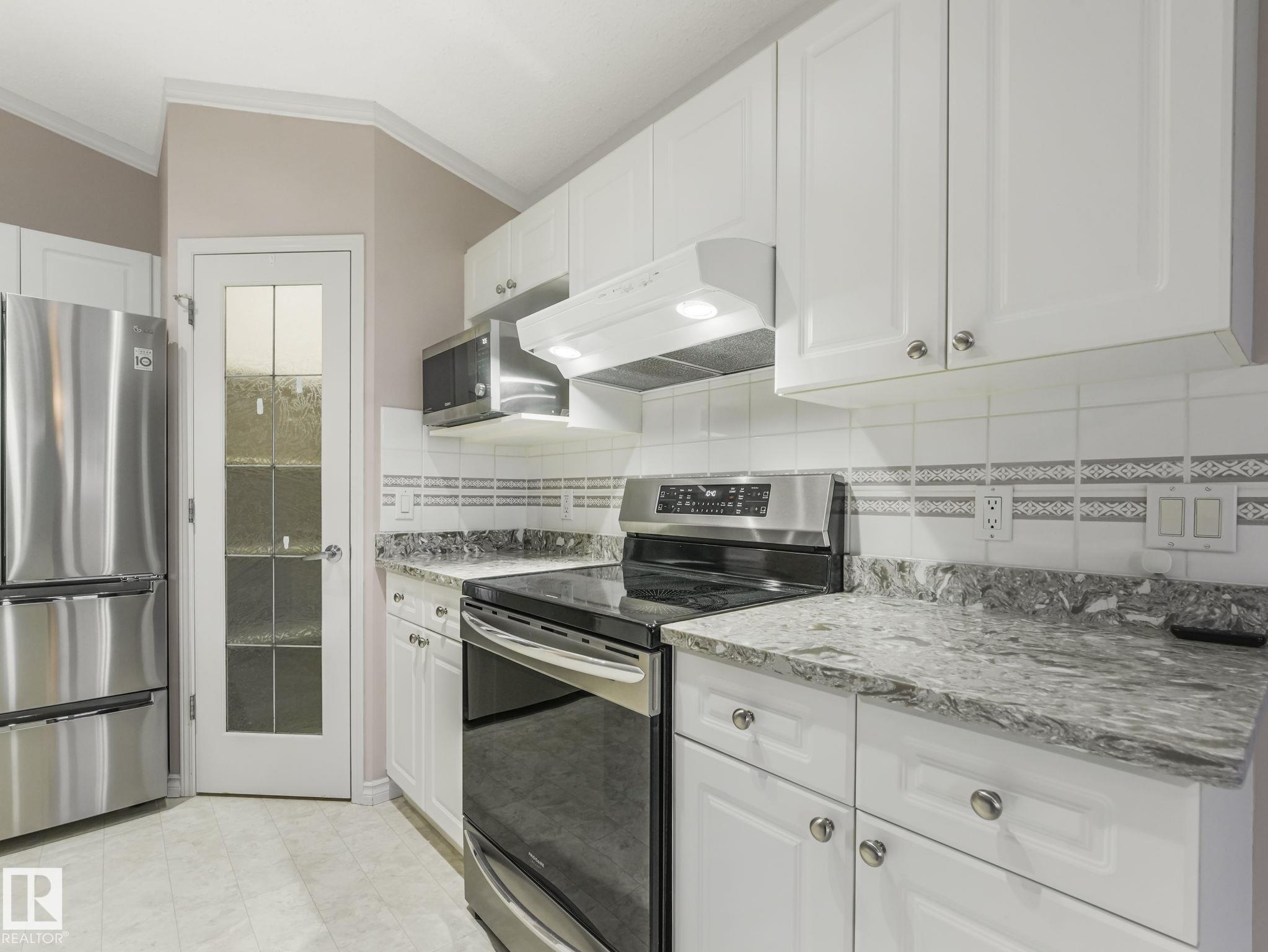 Photo 10 at 3620 130 Avenue NW, Belmont, Edmonton