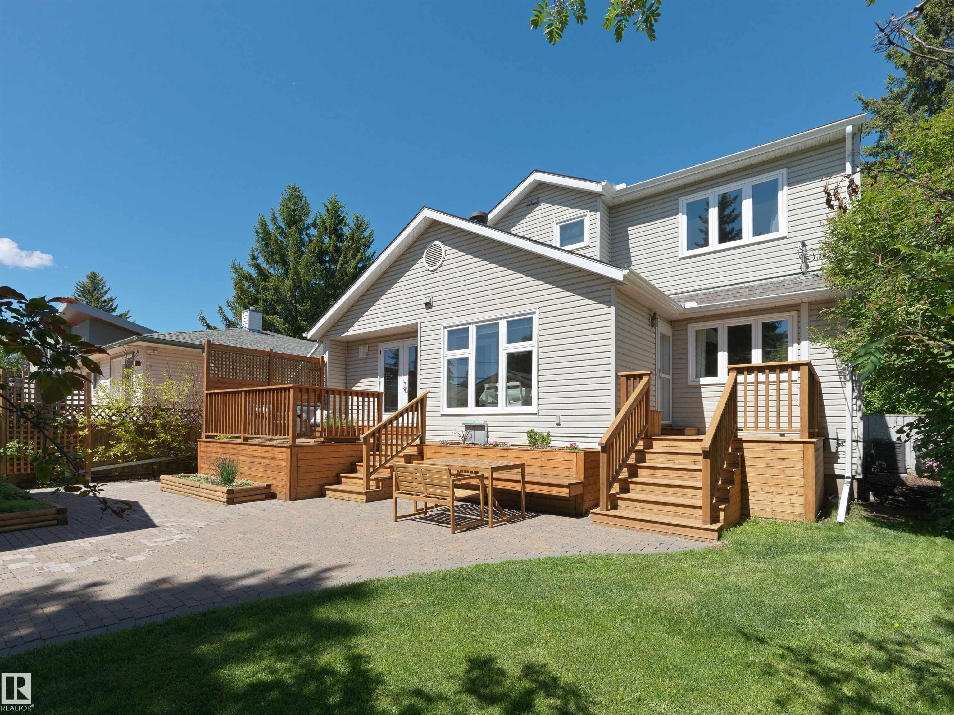 Years of care, pride, & serious investment show up in every corner of this home with LEGAL SUITE WITH SEPARATE ENTRANCE! Walk in, and the kitchen sets the tone immediately, fully rebuilt with quality cabinetry & stainless appliances. Every one of the four bathrooms got the same treatment. Hardwood, tile, & carpet throughout, every surface is mint. The home has newer shingles and on the mechanical side matches the cosmetic: triple pane windows, high-efficiency furnace, central A/C, & hot water on demand. Head out back & the south-facing yard gets sun all day, w/ a cedar deck and patio that give you somewhere to actually enjoy it, plus a newer detached garage. If you want the rental income it's ready to go, but day to day the house lives like a complete single family home. That kind of flexibility is genuinely rare. So is the address. Belgravia puts you steps from Saskatchewan Drive & walking distance to the UofA, UofA Hospital, Whyte Ave, & LRT. A home this complete does not come available often!
