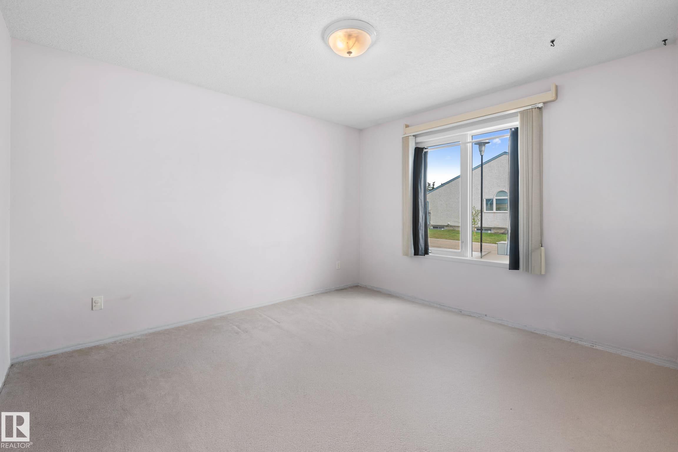 Photo 22 at 12 - 9718 176 Street NW, Terra Losa, Edmonton