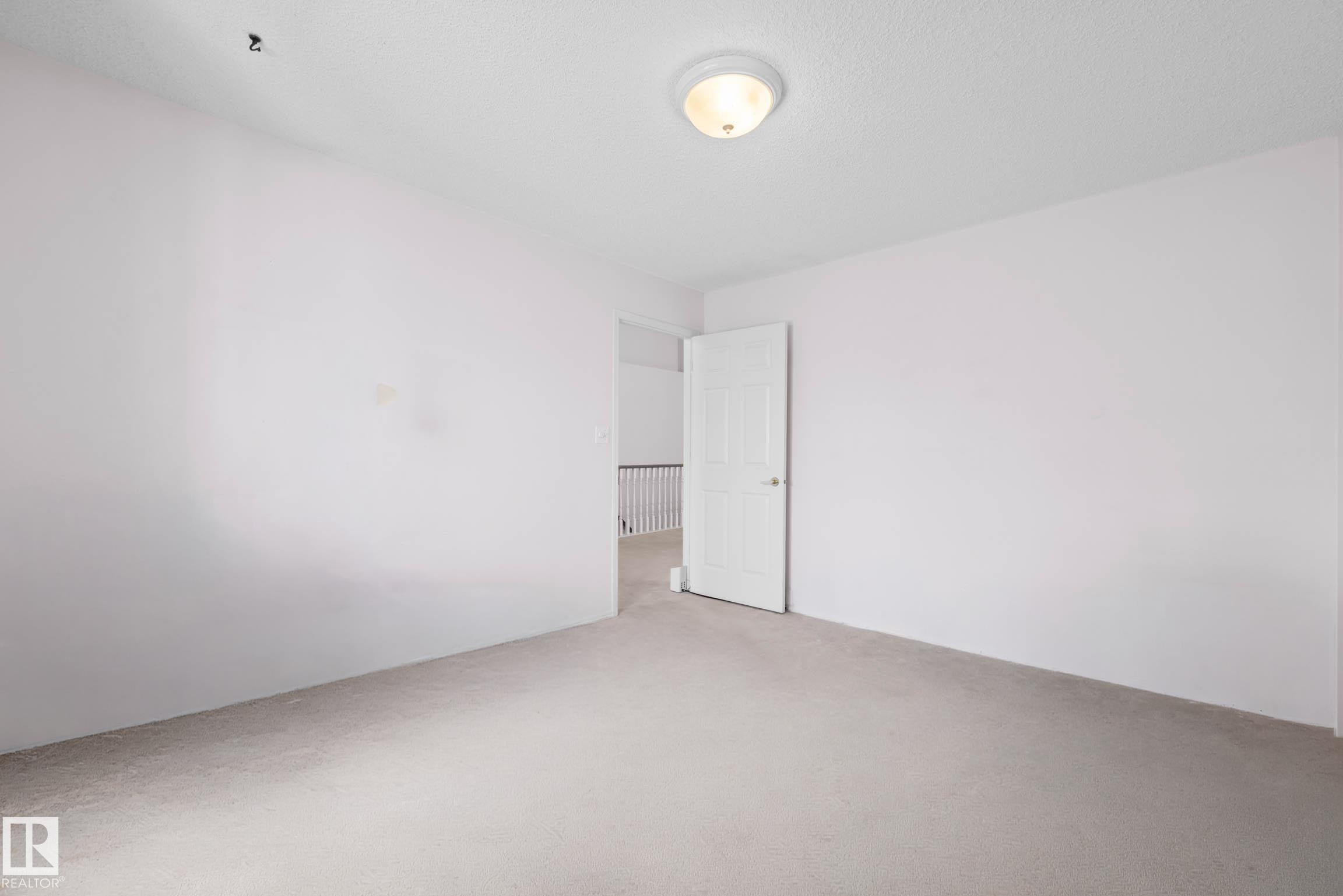 Photo 23 at 12 - 9718 176 Street NW, Terra Losa, Edmonton