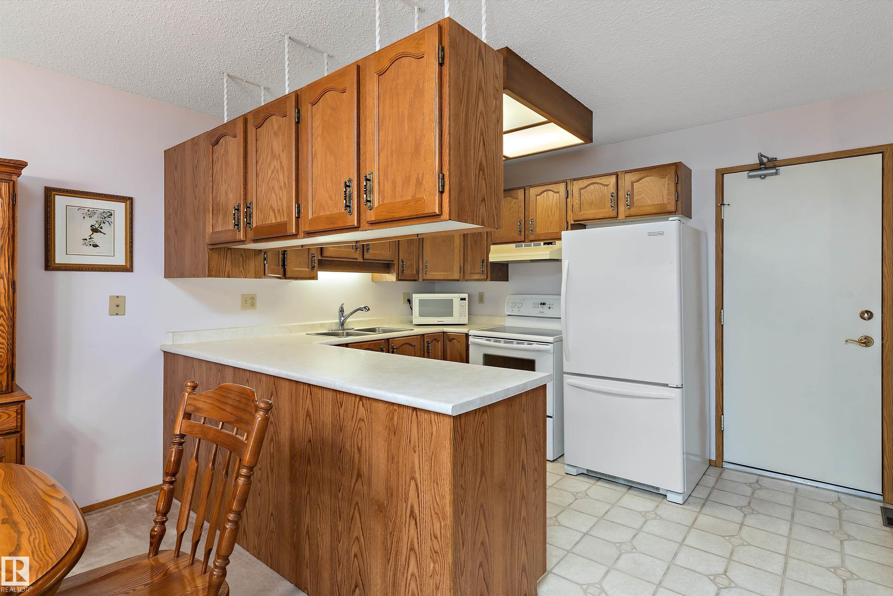 Photo 6 at 17404 Callingwood Road NW, Callingwood South, Edmonton