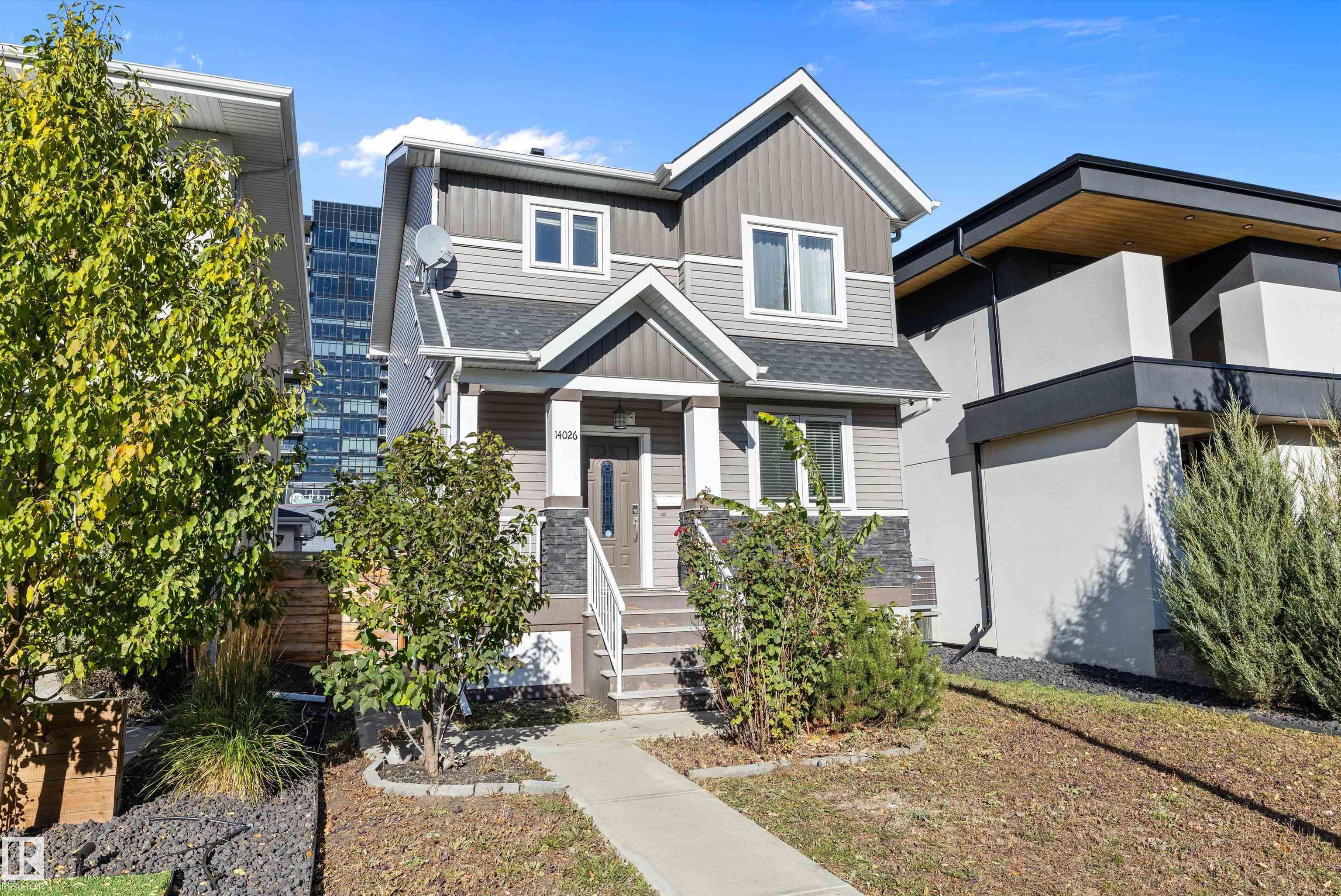 BEAUTIFUL 1627 sq. ft. 2 STOREY with FULLY DEVELOPED BASEMENT &  DETACHED GARAGE in GLENORA. This NEWER BUILT (2016) HOME features a  front verandah leading to the BRIGHT FOYER with tile flooring, off the foyer is a 2 pc. bath & a BEDROOM/DEN. GREAT ROOM STYLE with laminate flooring, ELECTRIC FIREPLACE with BUILT-INS & SURROUND SOUND. MODERN WHITE KITCHEN with stainless appliances, GAS STOVE, mosaic tile backsplash & QUARTZ COUNTERS & a generous dining room. There is mudroom with BACK DOOR access to the deck & yard. Upper level features a LARGE PRIMARY BEDROOM with WALK-IN closet, spa ensuite with dual sinks, SOAKER TUB & OVERSIZED TILE SHOWER. 2 additional beds, a 4 pc. main bath & a handy laundry completes the upper level. The 665+ sq. ft. finished lower level features a family room/kitchen, 2 beds, a 4 pc. bath, laundry & more. LOW MAINTENANCE LANDSCAPED FENCED YARD with COMPOSITE DECK & GARAGE. FEATURES:CENTRAL AIR, 2 FURNACES & more. Great central location just south of Stony Plain Road.