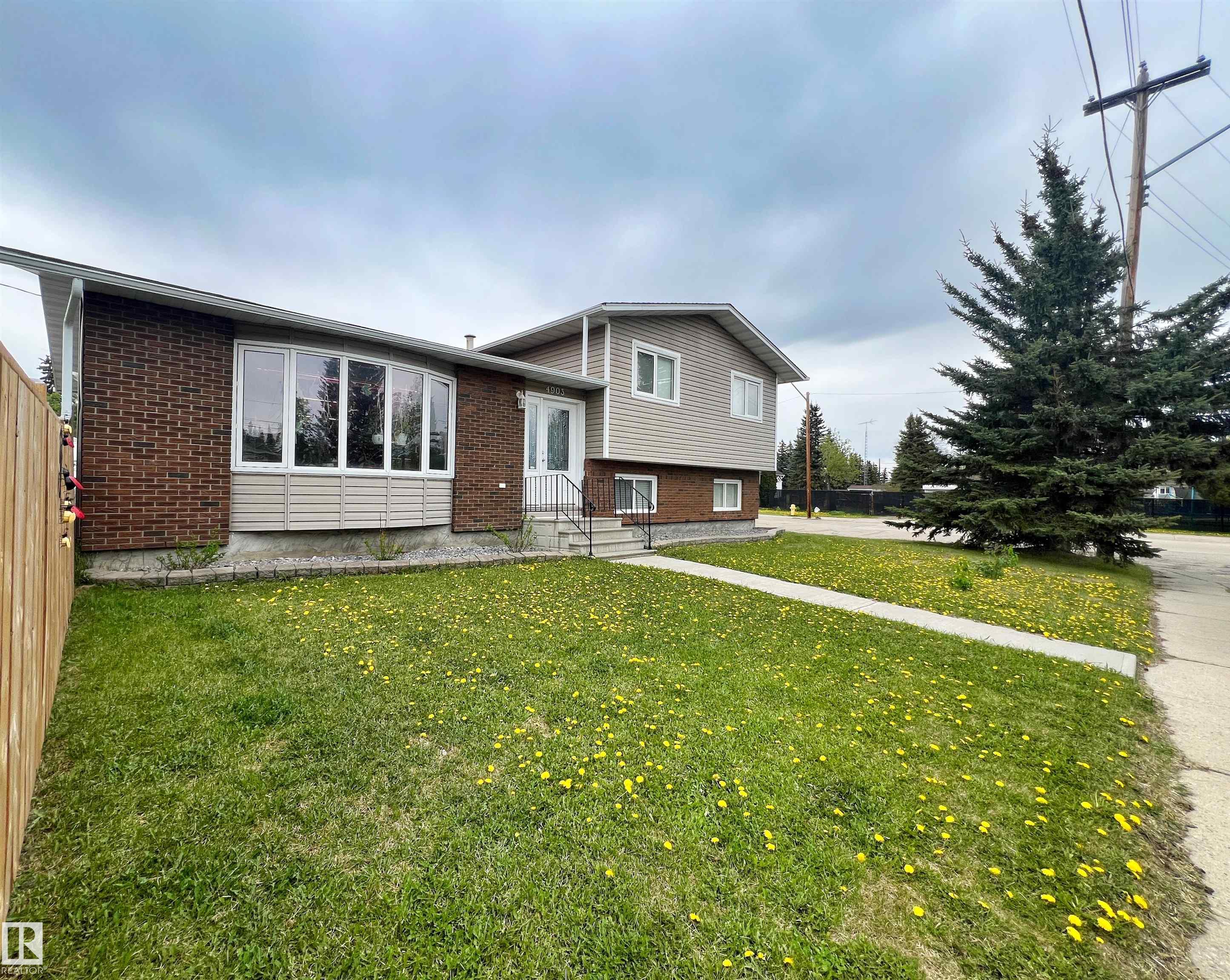 EVANSBURG - 4 Lvl Split - 1,800sqft+ Living Space ~ Corner Lot - Fully Fenced - 4 Bdrms - Fireplace.  Main ~ Kitchen, Living & Dining Rm w/ Access to Backyard - Lower ~ Family Rm w/ WoodBurning Fireplace - 3pc Bath - Laundry - 4th Bdrm - Basement ~ Utility Area & Storage - Upper ~ 3 bdrms - 4pc Bath. Fully Fenced Big Yard  for the Kiddo's or Your 4-legged Friends - Storage Shed - Deck. Community Amenities are a Close Walk. Reflect on Wider Streets, Larger Backyards, that Community feel were it's expected you'll roll slowly along. Evansburg is located along Hwy 16 approximately 88 km(55m) west of Edmonton & 96 km(60m) east of Edson. Minutes to the Famous Pembina River for Rafting & Tubing ~ Camp in the  Provincial Park or explore the numerous Hiking Trails or catch a quick glimpse of the variety of wildlife.