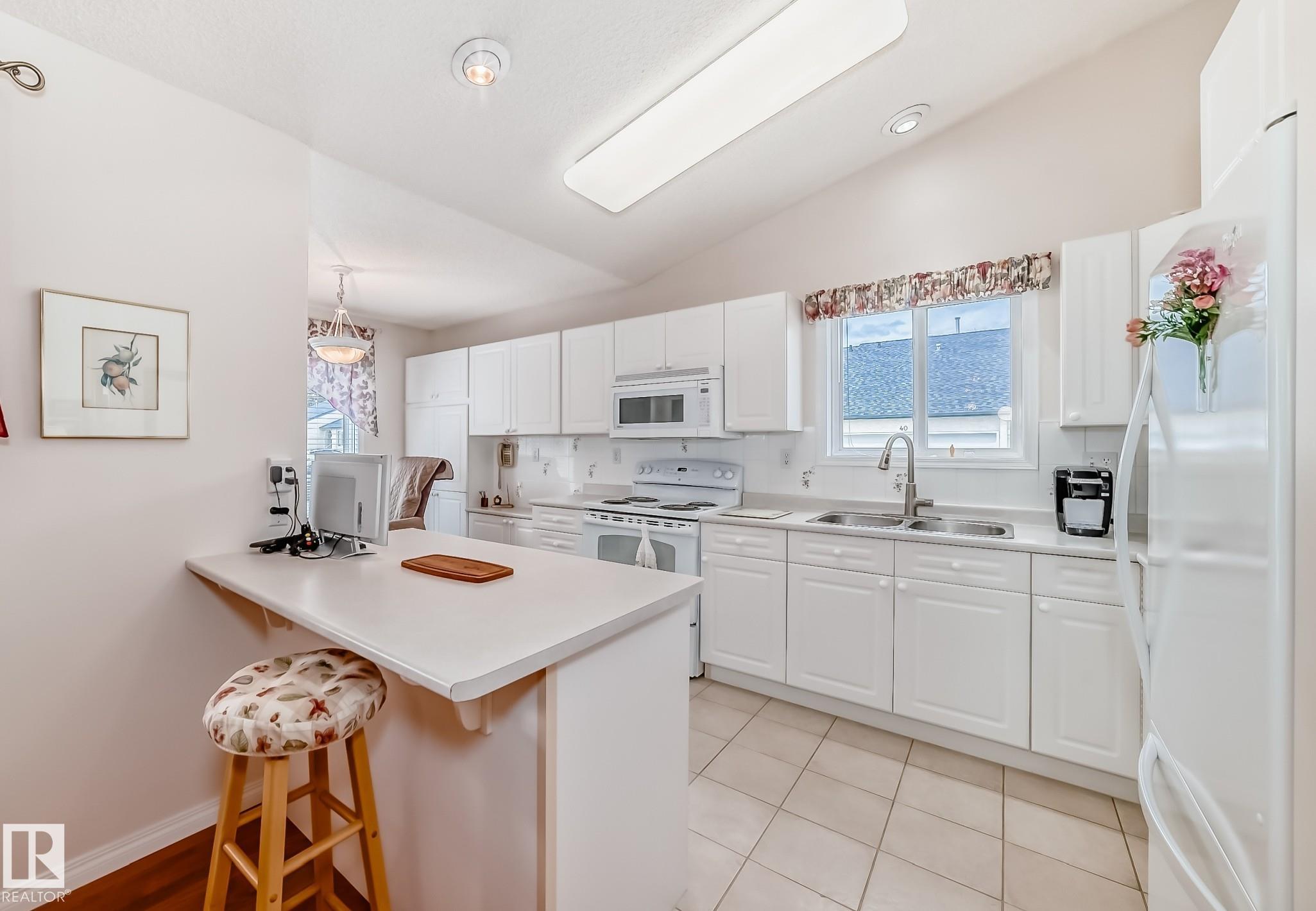 Photo 18 at 49 - 9718 176 Street NW, Terra Losa, Edmonton