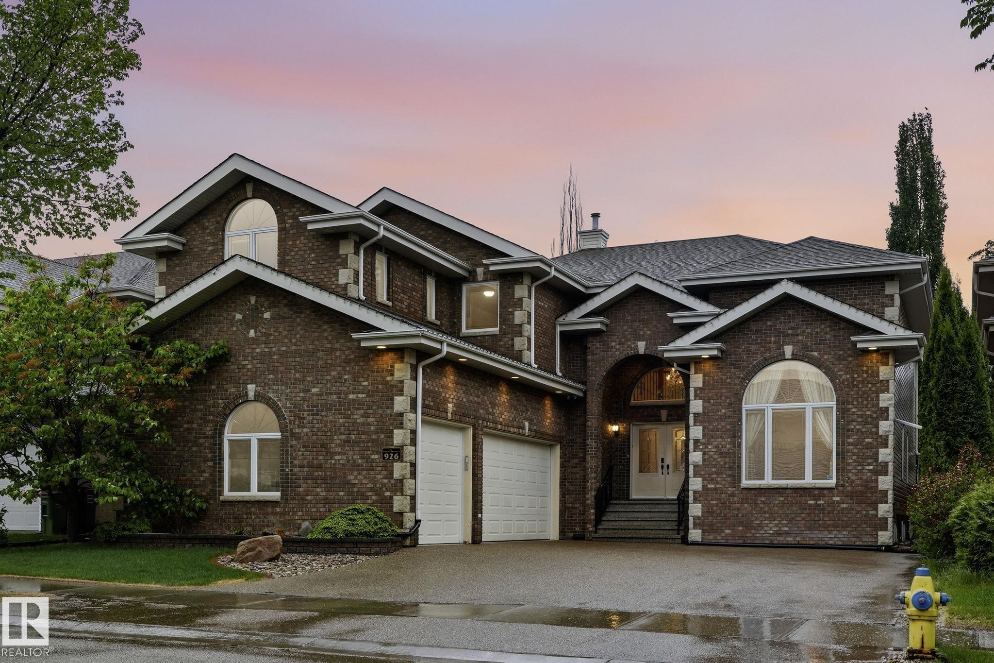 WELCOME TO HOLLINGSWORTH BEND, in the Prestigious community of Hodgson. This CUSTOM BUILT ACE-LANGE LUXURY HOME with TRIPLE ATTACHED HEATED GARAGE boasts 7 bedrooms, 7 bathrooms, and over 5,600 SQ.FT of living space. Notable features incl, NEW AGGREGATE DRIVEWAY(2025), Heated floors throughout the home, and a Beautiful Cedar Covered Patio. The Main floor chef-inspired kitchen equipped w/ HIGH-END APPLIANCES and walk-in Butler pantry w/ second cooking space. A spacious breakfast nook, formal dining room & elegant living room w/ Custom paintwork. Large family room w/ cozy fireplace, main floor bedroom w/ 3-piece ensuite & laundry rm complete the main level.  The 2nd level provides a stunning primary retreat w/ 5-piece ensuite and walk-in closet. 3 more Bedrooms (all w/ ensuites incl. one Jack-n-Jill), a den/guest room, and an open office space complete the upper level.  The fully finished basement offers a massive rec room, wet bar, two more bedrooms, 2 full bathrooms, plenty of storage, and utility space.