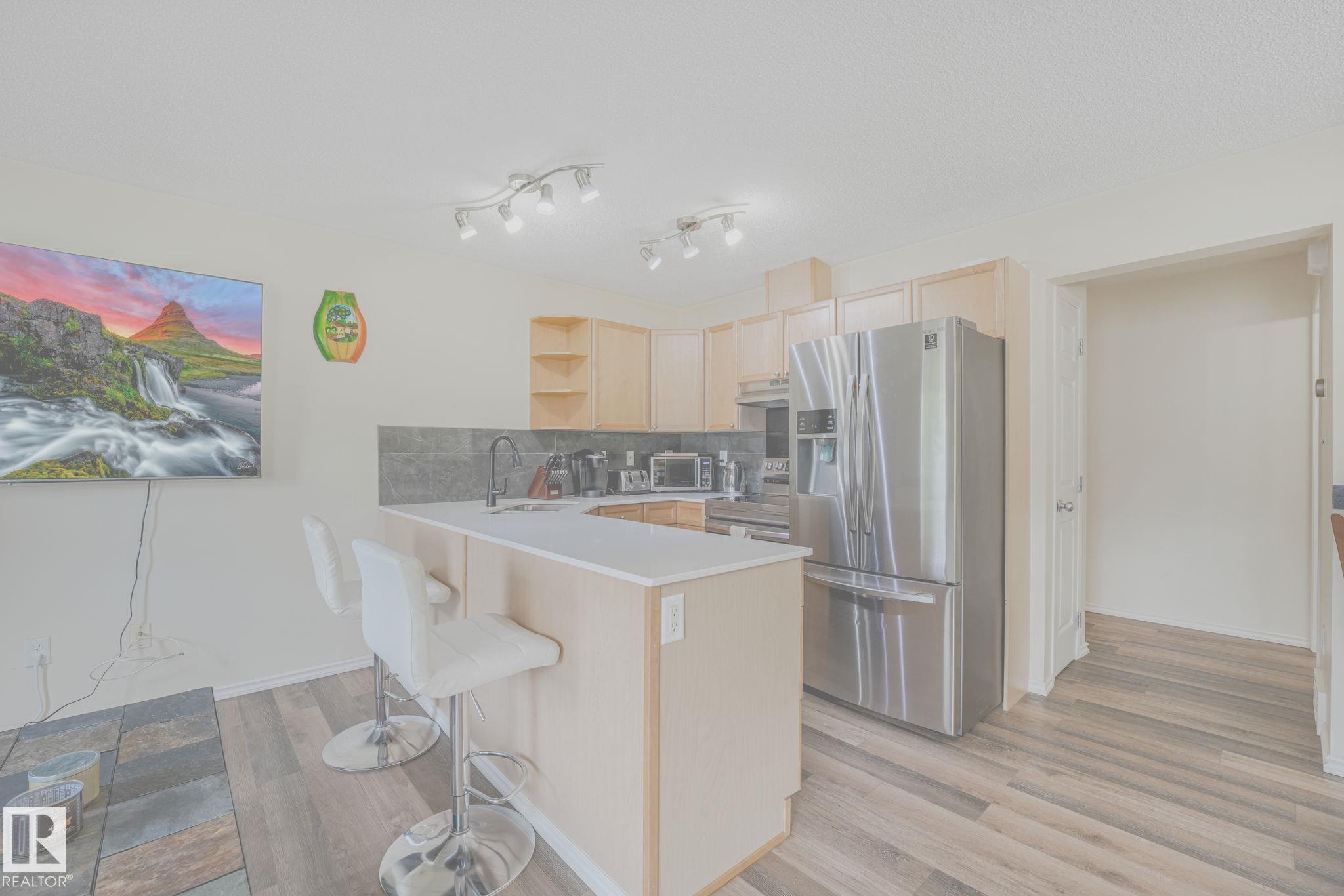 Photo 8 at 56 - 451 Hyndman Crescent NW, Canon Ridge, Edmonton