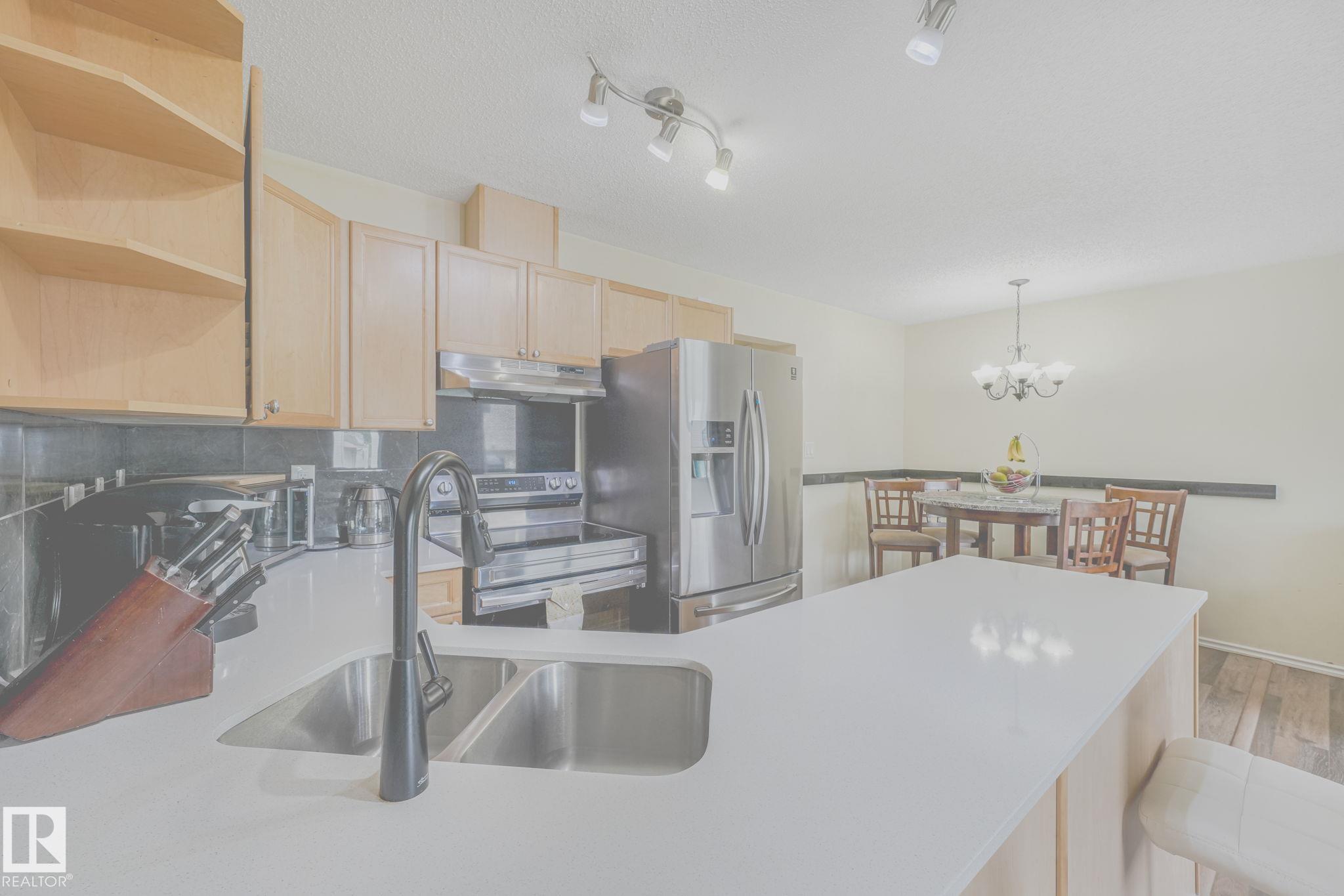 Photo 9 at 56 - 451 Hyndman Crescent NW, Canon Ridge, Edmonton