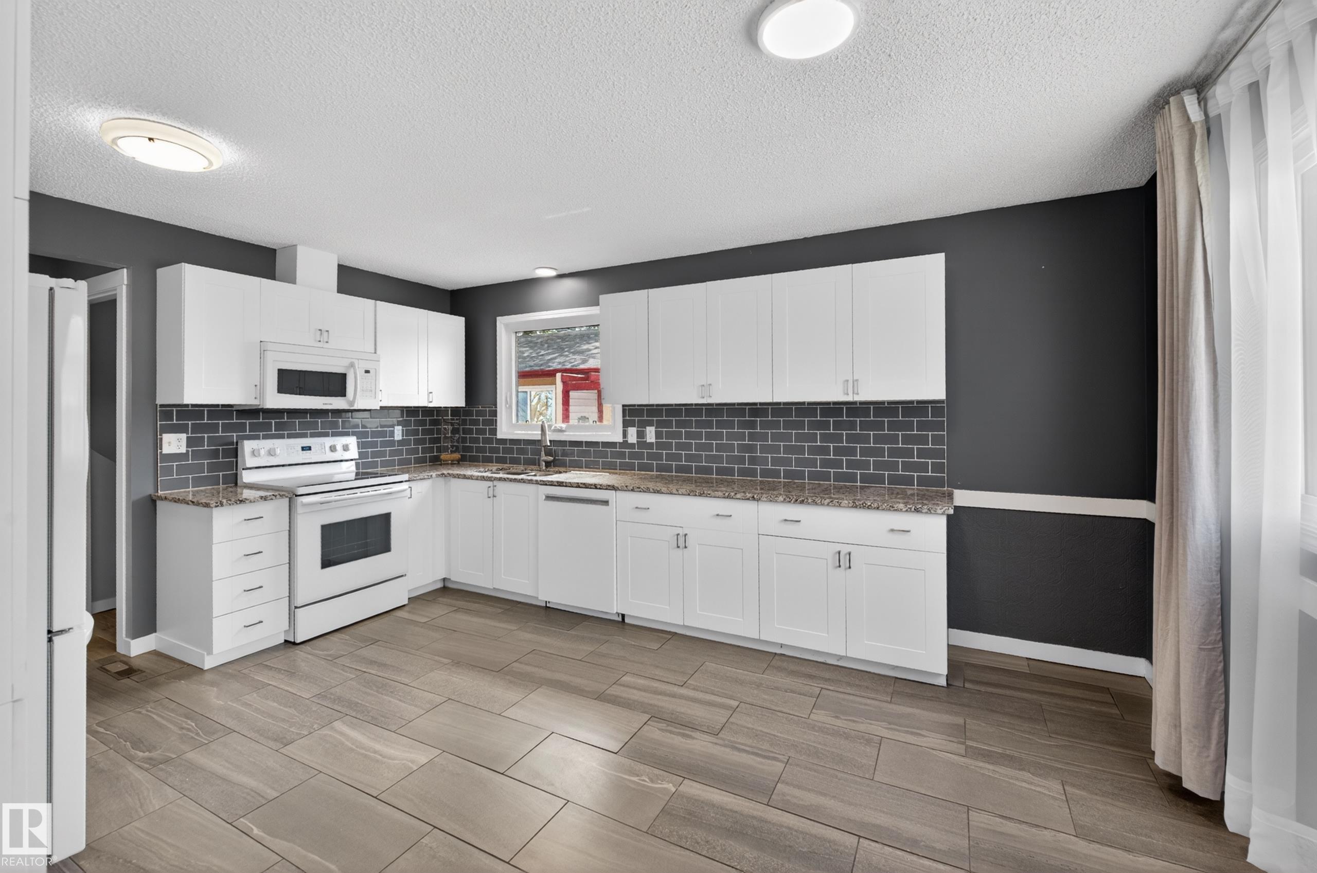 Photo 13 at 15115 22 Street NW, Fraser, Edmonton