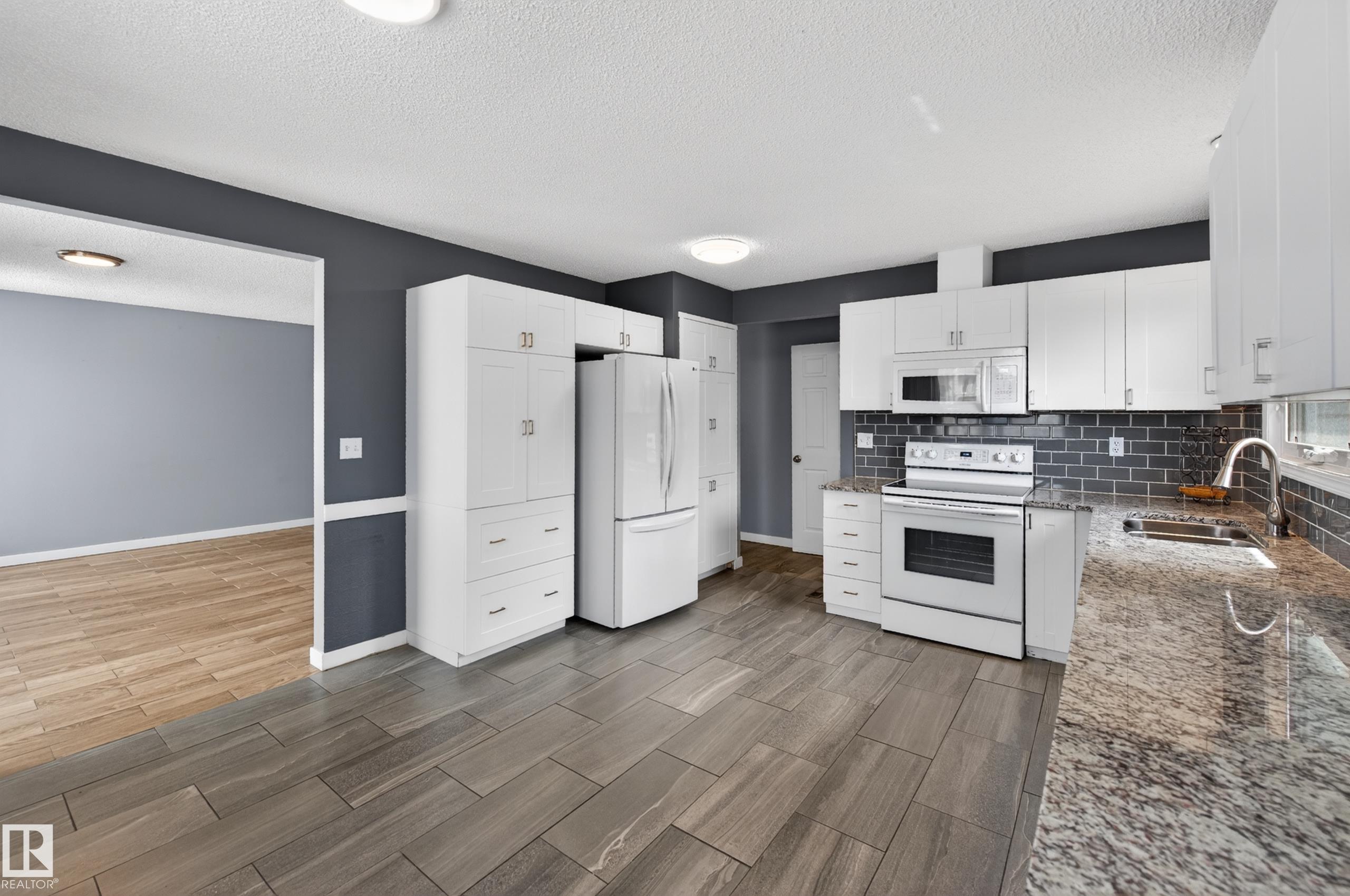 Photo 14 at 15115 22 Street NW, Fraser, Edmonton